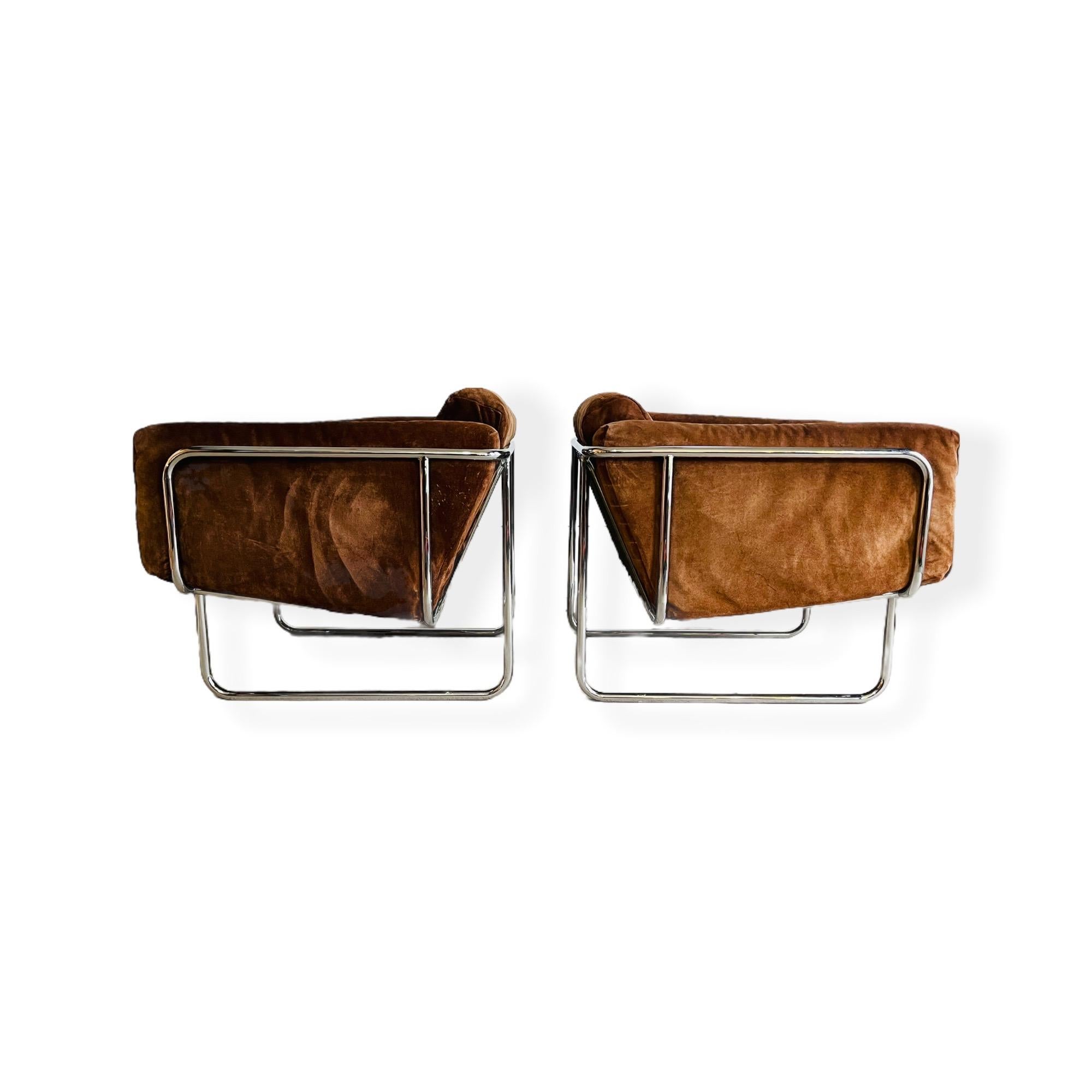 Here is a vintage Danish modern tubular chrome lounge chairs by Hans Elchenberger of Denmark circa 1960s. These gorgeous chairs have original brown suede upholstery with minor wear / patina consistent with age and use. Chrome frame is in good