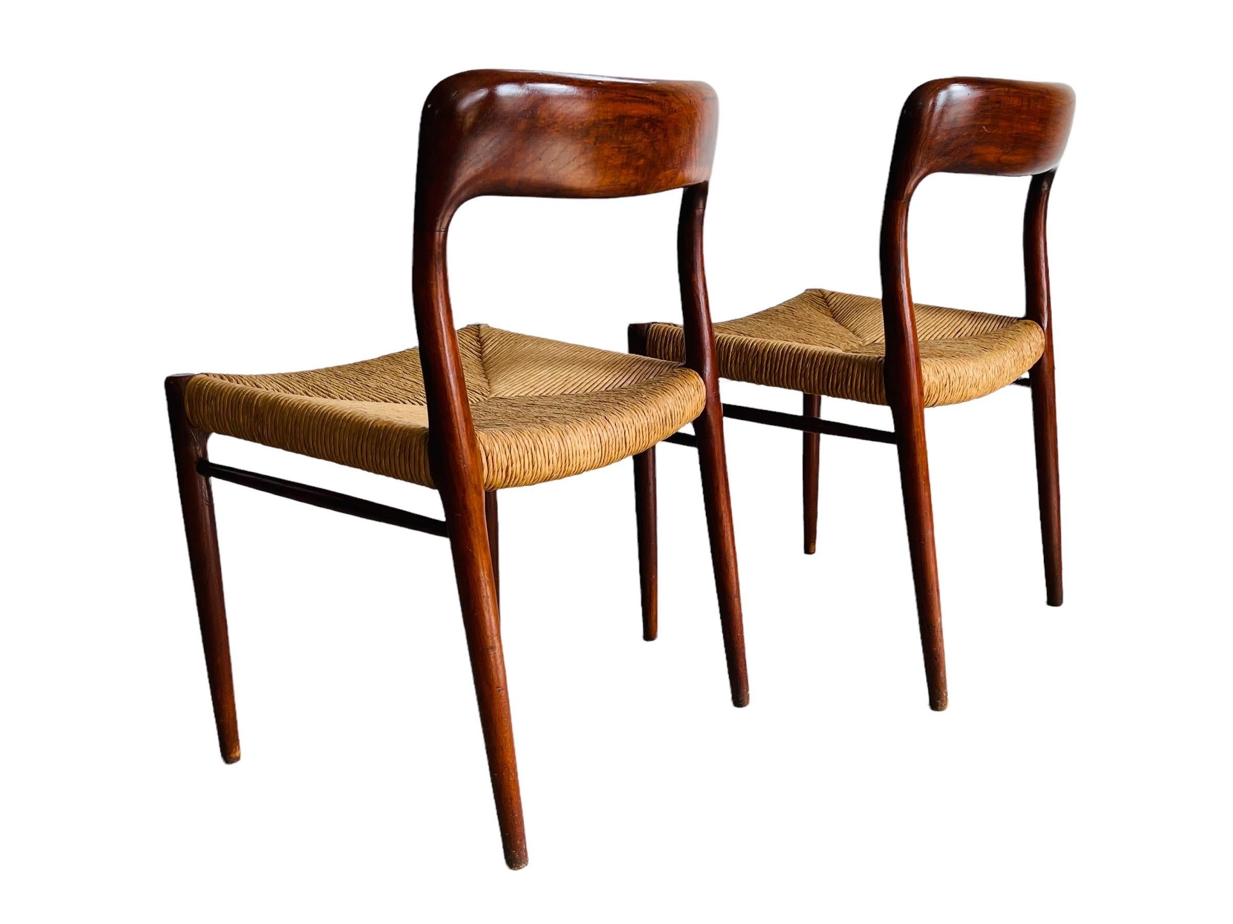 Two Niels Moller model #75 dining chairs in teak, beautifully aged. Both chairs are in good vintage condition with normal wear consistent with age and use. The chairs are sturdy and ready for use. 

Measures: W 20