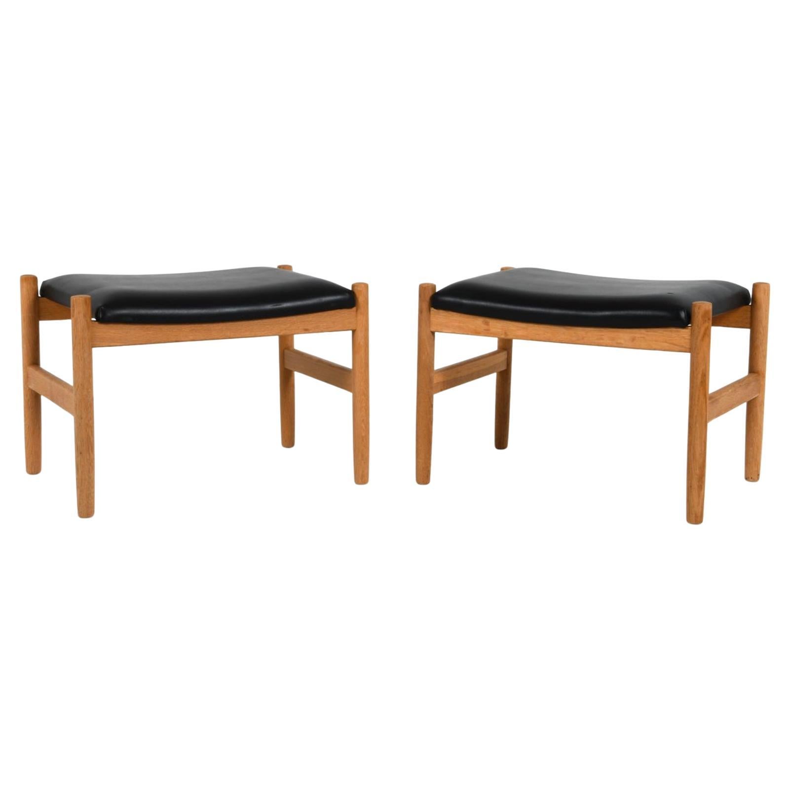 Scandinavian Modern Pair Danish Modern Oak and Black Leather stools by Hugo Frandsen for Spottrup For Sale