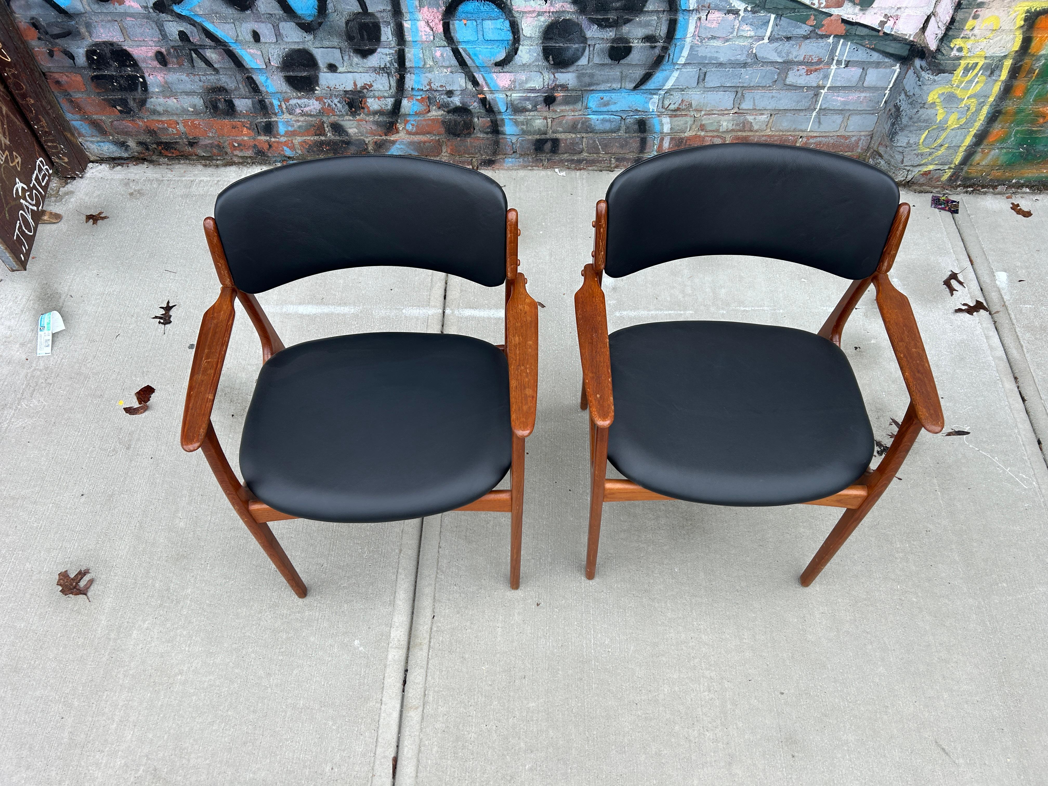 Scandinavian Modern Pair danish modern Teak model 49 leather dining arm chairs by Erik Buch For Sale