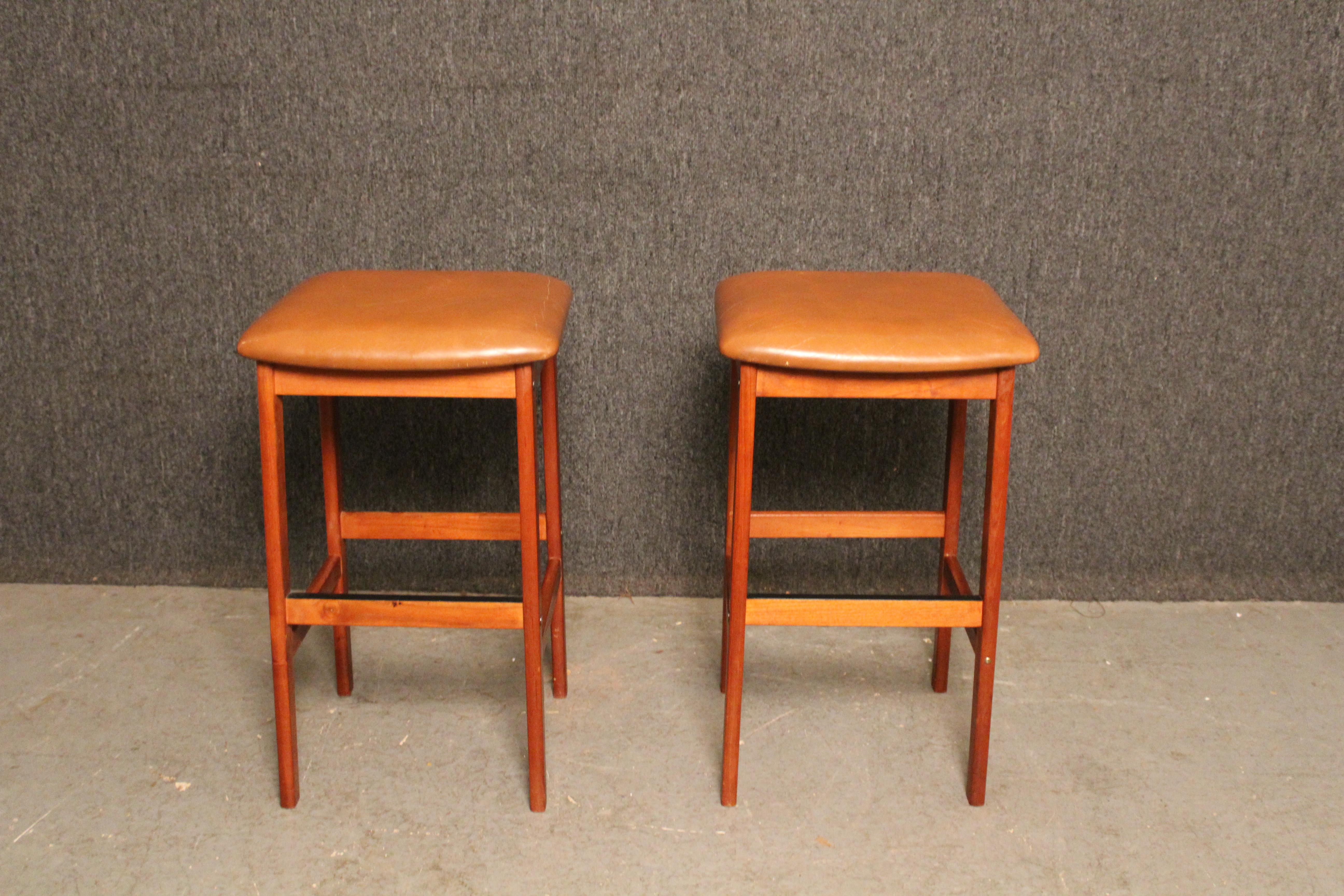 Perch yourself atop classic mid-century Scandinavian modern design with these simple teak stools from Denmark's Korup Stolefabrik. With a shortened 26
