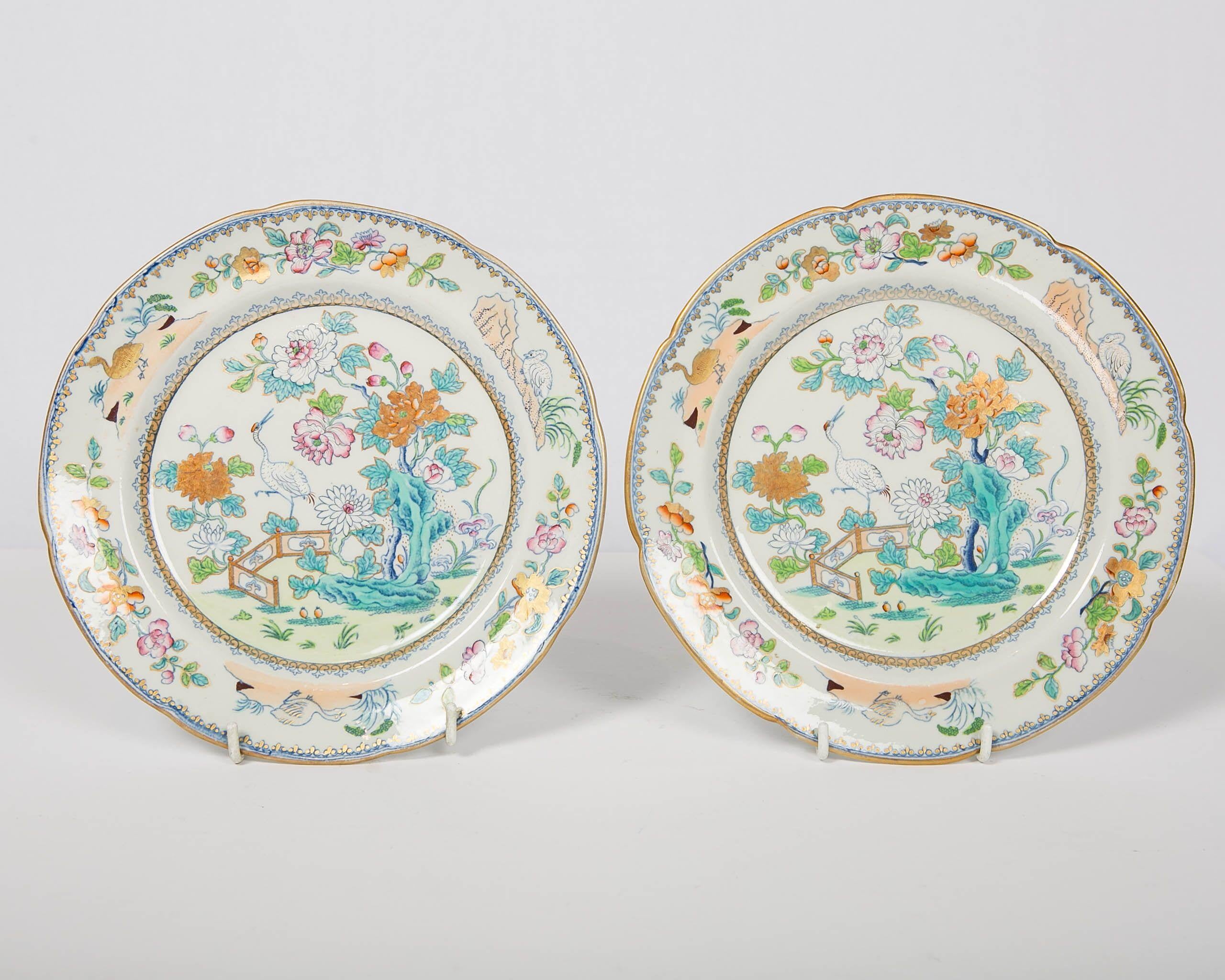 We are pleased to offer this pair of colorful chinoiserie decorated Davenport plates made in England, circa 1820. Davenport was known for the beauty and originality of its designs. This pair of dishes have hand painted details over a printed design.