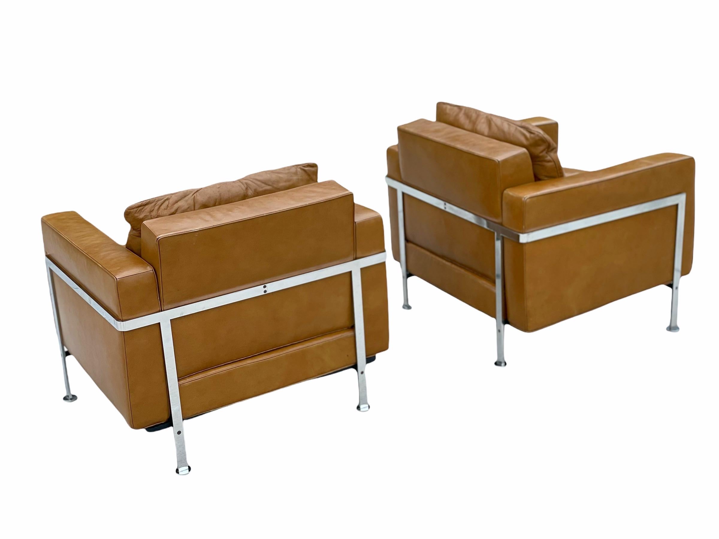 Exquisite pair of model RH302 lounge chairs designed by Robert Haussmann. Built by De Sede in Switzerland and imported to the states by Stendig circa 1960. This model does not surface in the United States often. Chromed steel frames and luscious