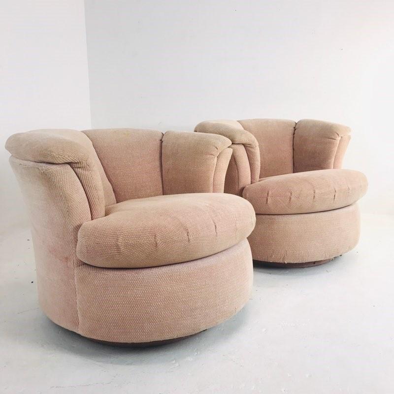 Pair of 1970s lotus style swivel chairs. This pair of chairs are well made, they have a heavy, substantial feel and turn beautifully.