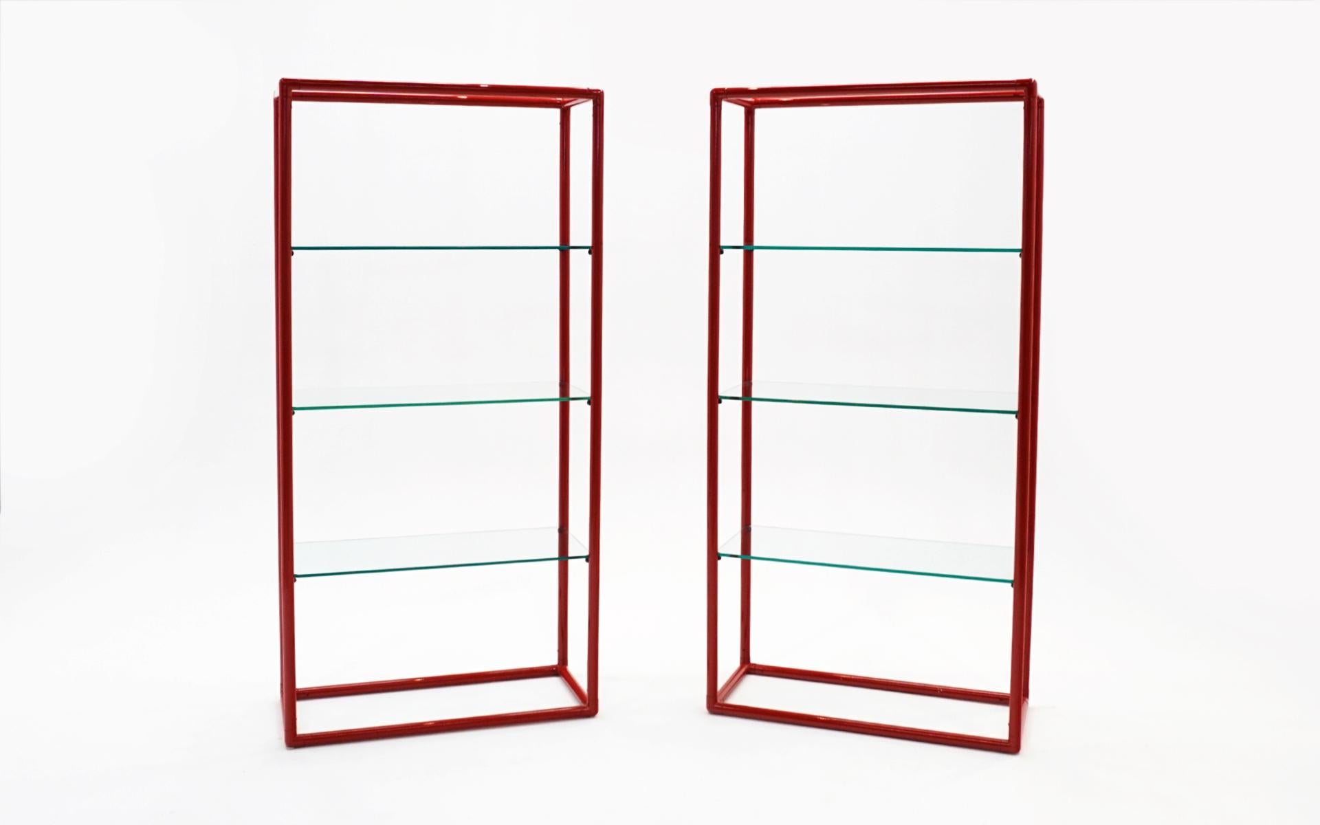 Two display / storage shelves with 3/8 inch polished edge glass and red enameled tubular frames. Very good condition. Price is for each. These would work well in any mid century, post modern, or contemporary environments.