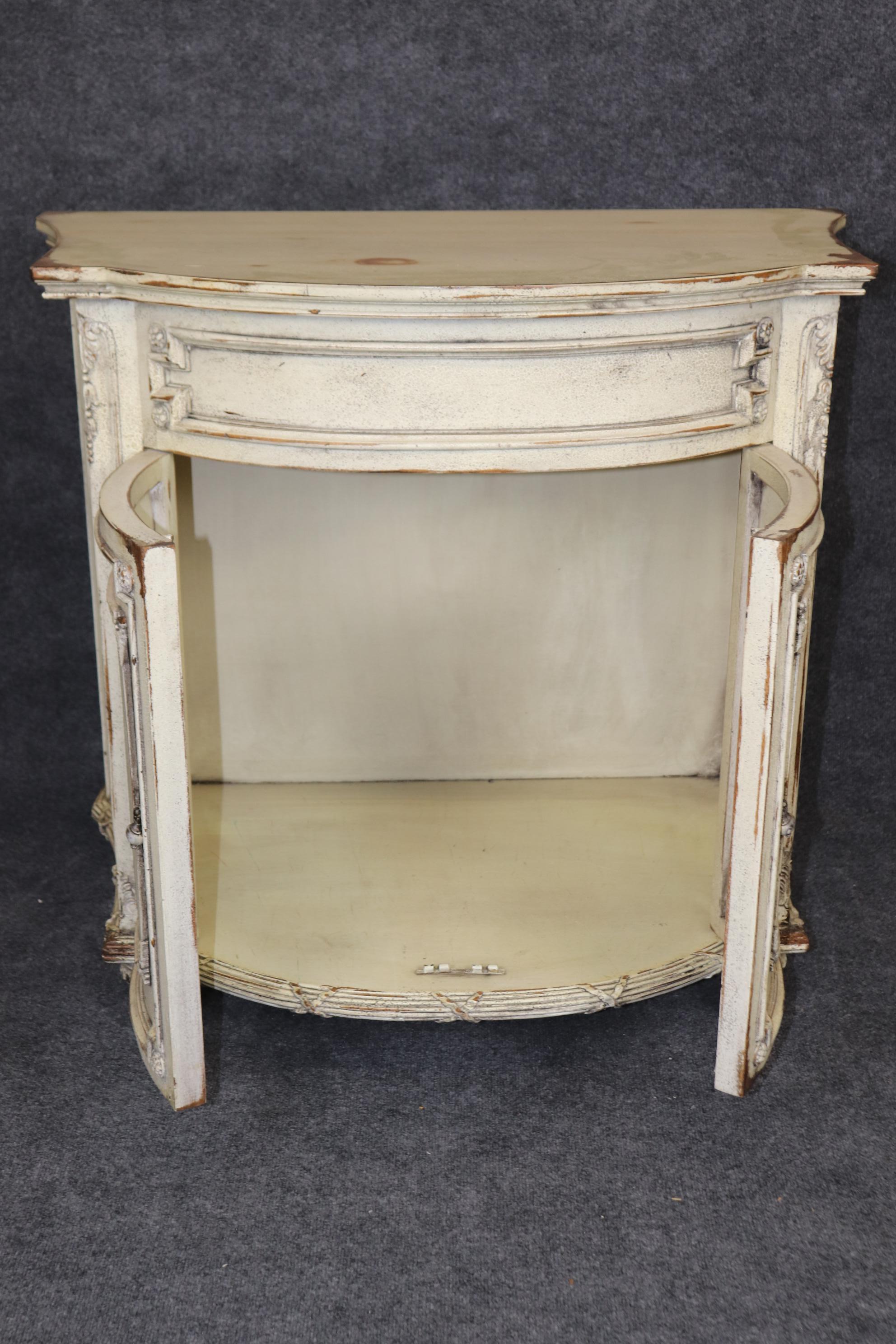 This is a beautiful pair of Habersham Plantation style heavy solid mahogany distressed side cabinets or commodes. They are designed to look like antique French pieces with fake wormholes and a distressed white painted finish. They are in good