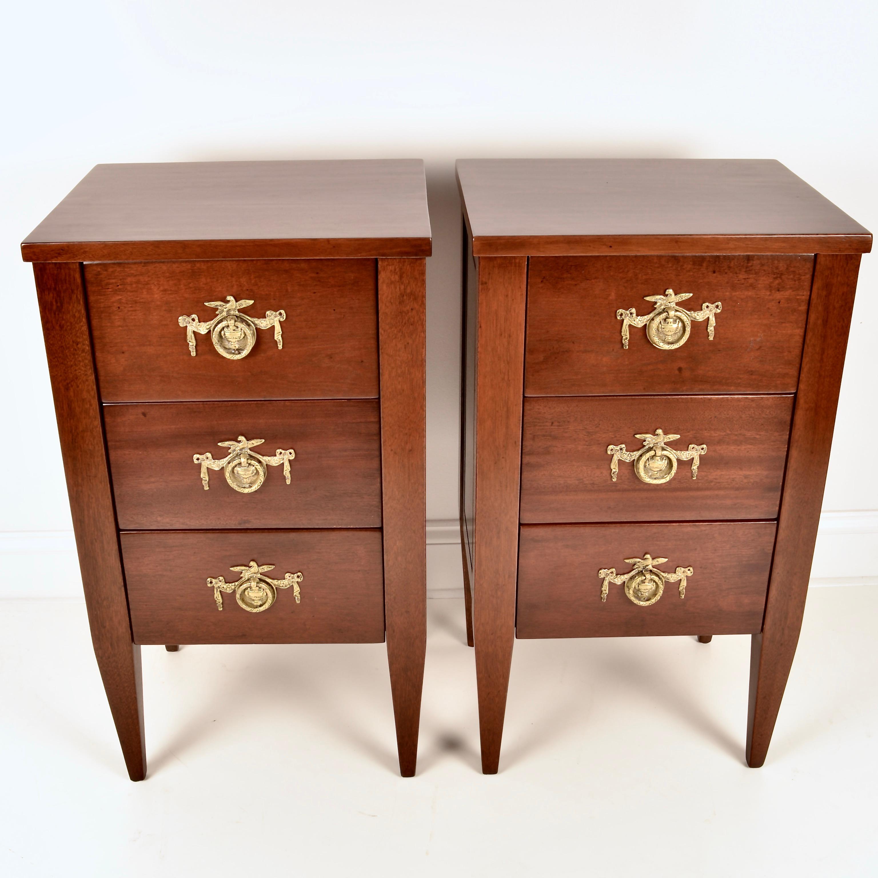 A pair of small chests, perfect for bedside or other side tables. Each has 3 drawers stylishly lined in the Ruseau signature style with vintage wall paper. Solid brass neoclassical hardware. This pair has been fully restored to original mahogany