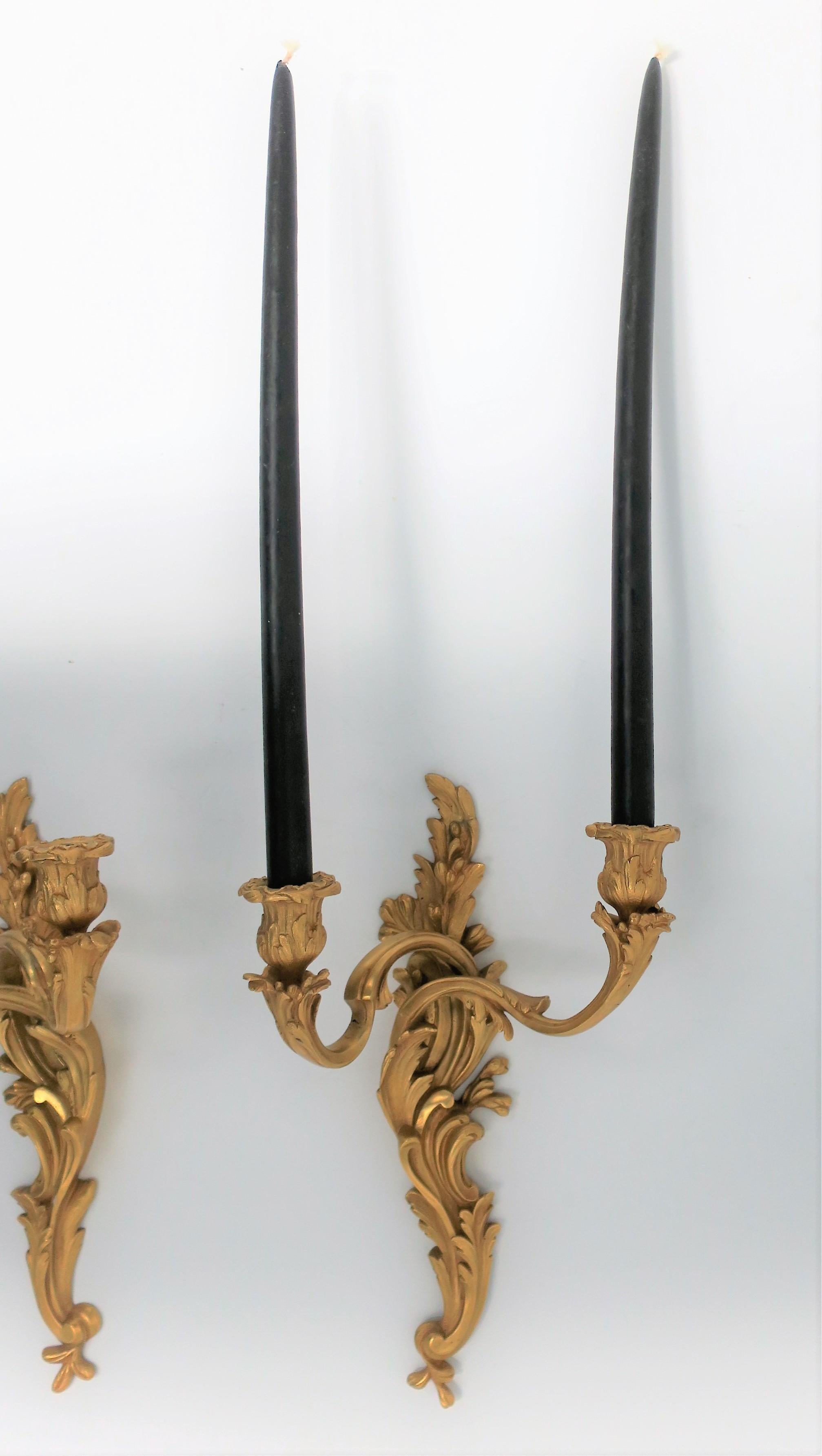 A very beautiful and substantial pair of Rococo style Dore' gold gilt bronze candlestick wall scones. 

Each sconce measures: 6