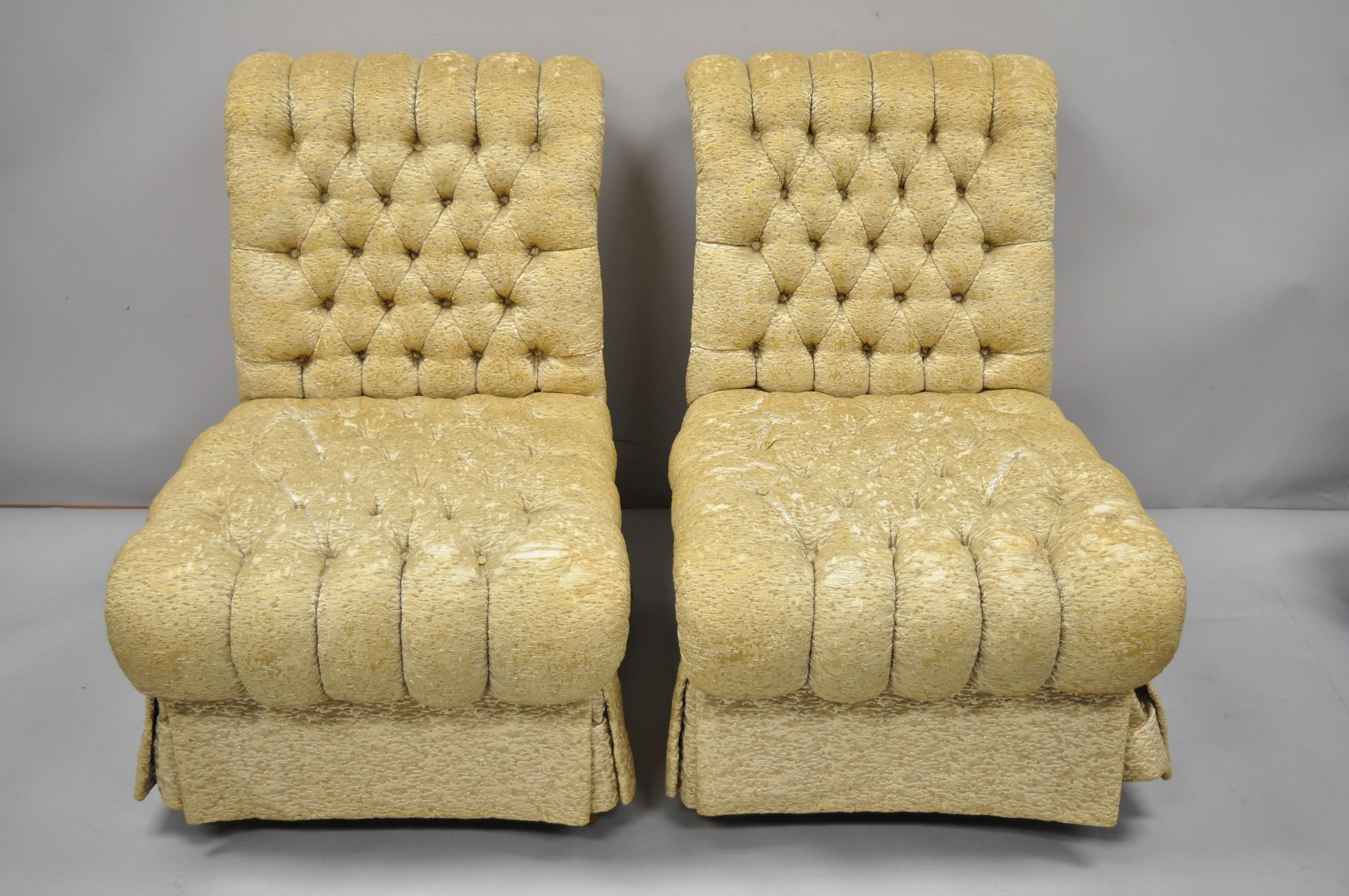 Pair of Vintage Dorothy Draper style French Hollywood Regency rolled back slipper lounge chairs. Item features dramatic rolled backs, button tufted upholstery, comfortable deep frames, solid wood tall legs, very nice vintage item, sleek sculptural