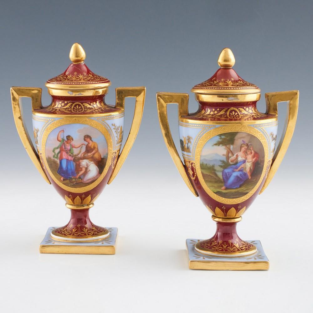 Heading :  Pair of Dresden Vienna style porcelain vases
Date : c1890
Marks : Underglaze hand painted pseudo Bindenschild marks and paper labels for the retailer ATE (Atellier) Baillet 48 Rue de Lycee in Pau. Overglaze red text describing the scenes