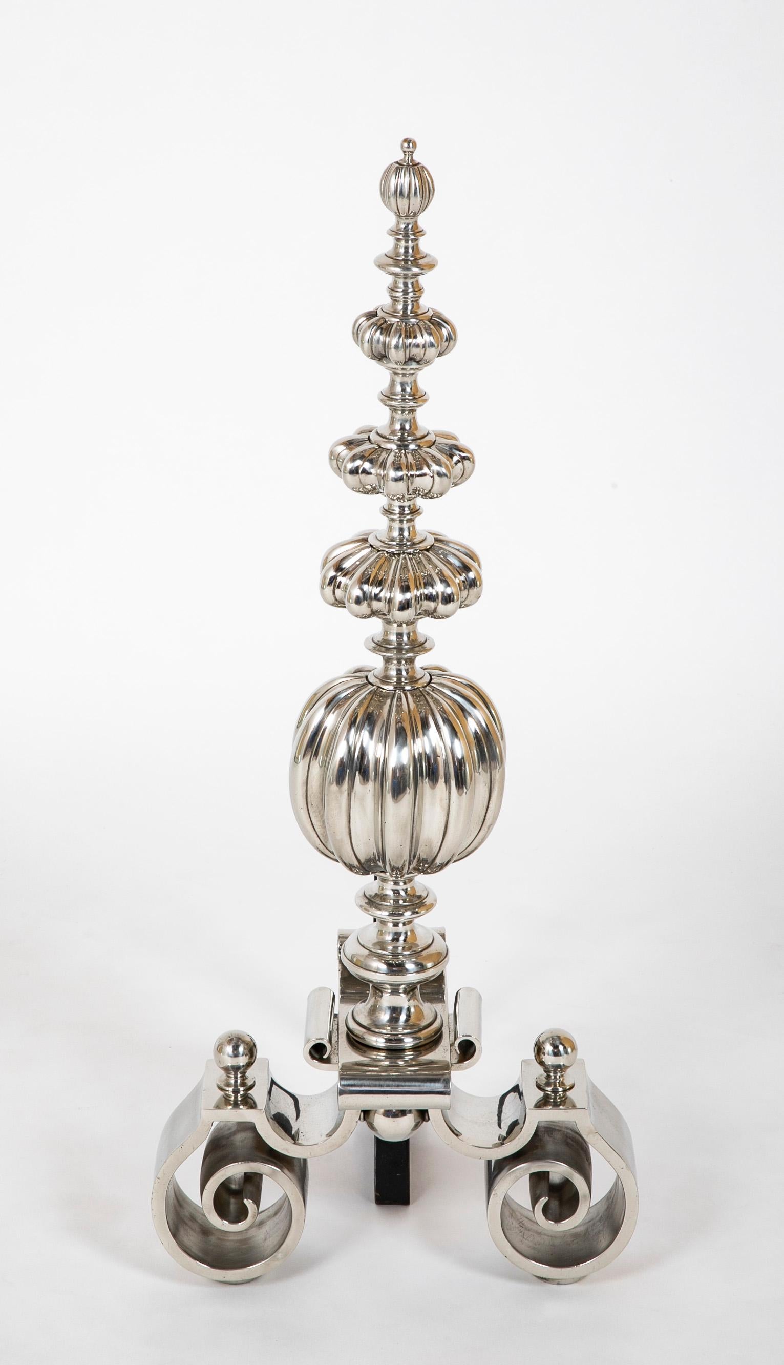 Fantastic pair of polished steel andirons in the Dutch Baroque style. With melon forms stacked above a delicately rendered S-curve base. A very successful modern interpretation of the 17th century Baroque style.
 