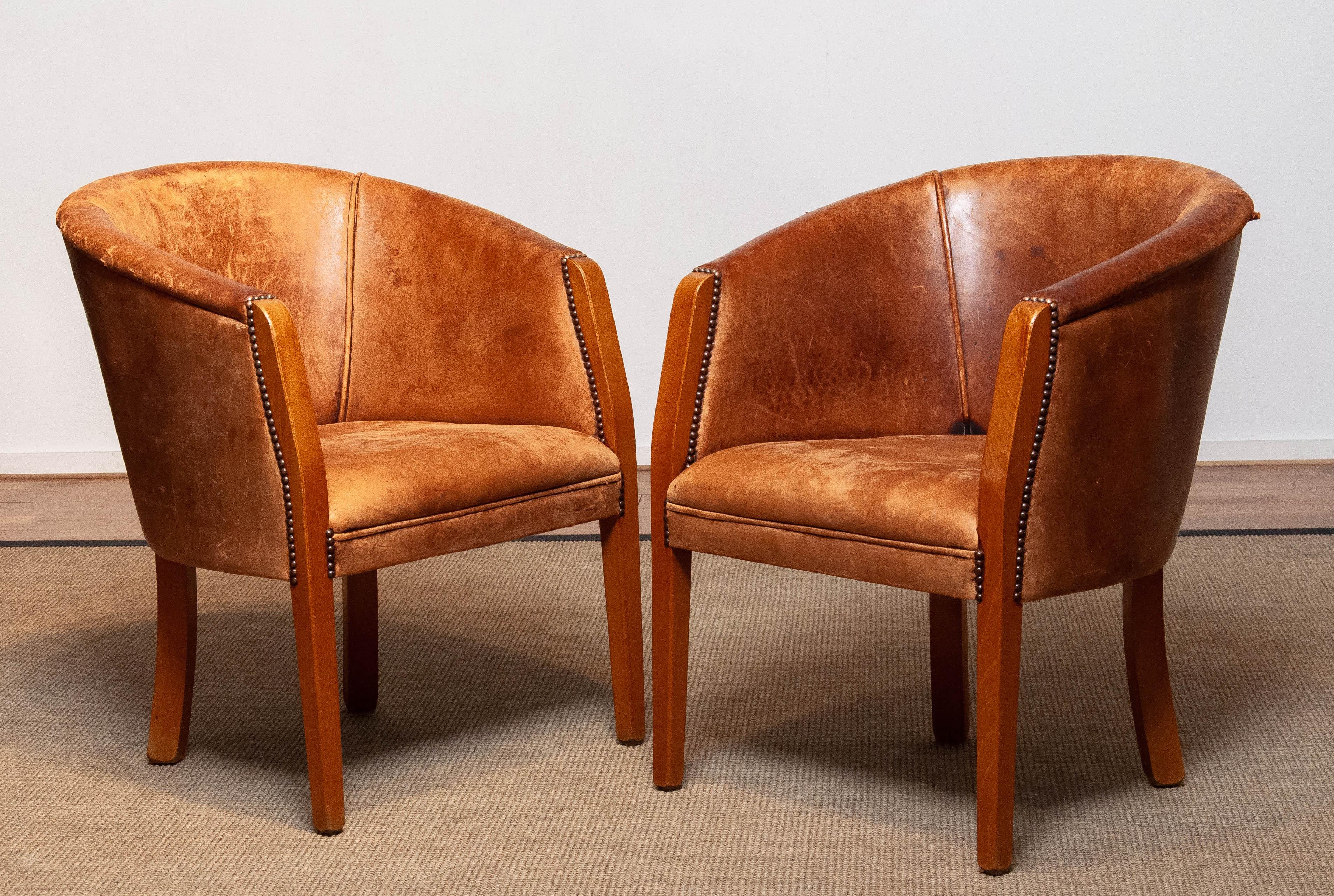 Beautiful pair Dutch colonial arm chairs upholstered with sheepskin / leather with a great patina true the years. Both are allover in good and comfortable condition.
Please note that the seat hight is 17 inches / 45 cm.
  