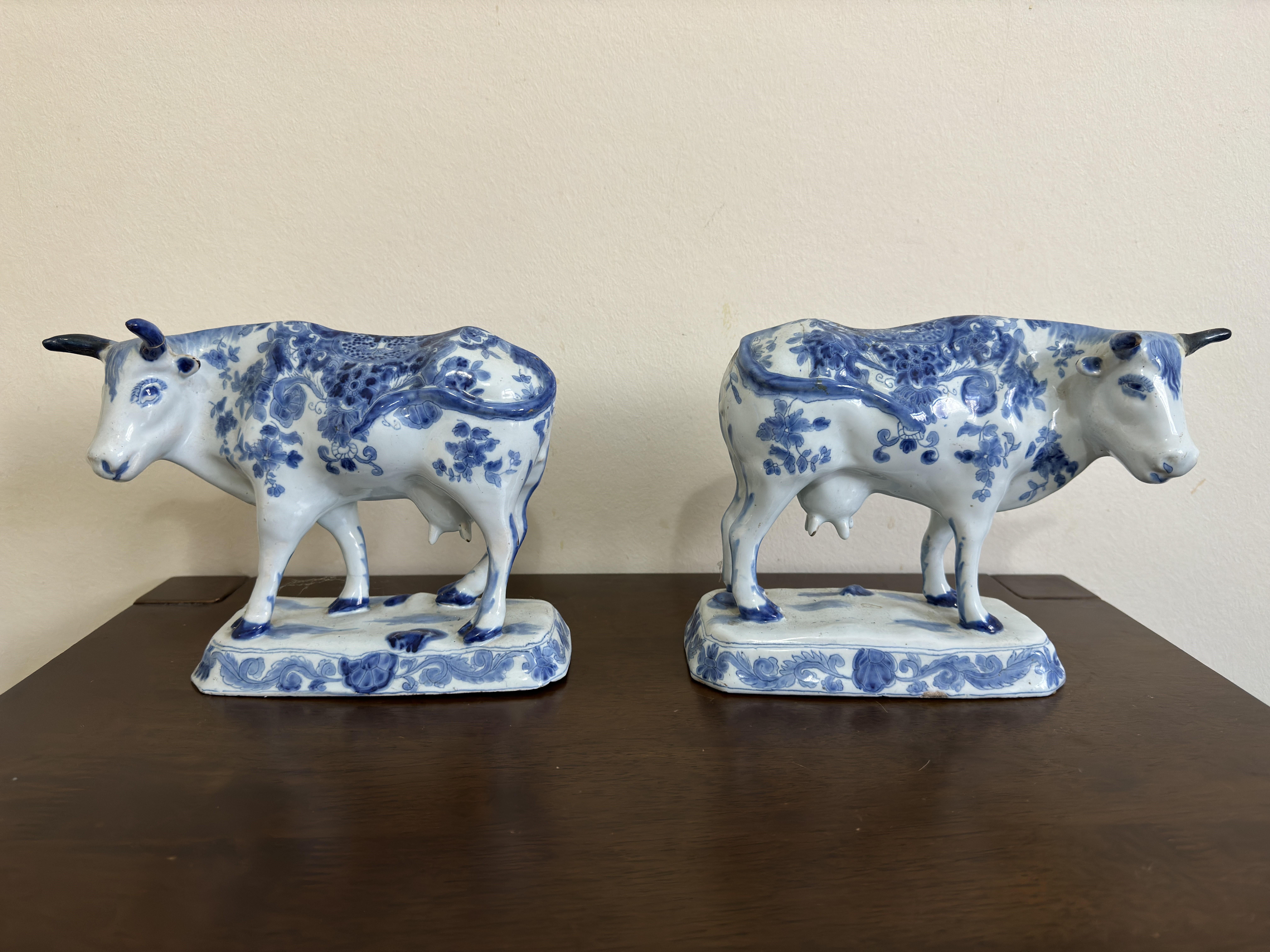 A rare pair of 18th Century Dutch Delft cows, blue and white, made in the De Twee Scheepjes (The Two Little Ships) factory, circa 1780.

24 cm (9 inches) long, 18 cm (7 inches) high, 10 cm (4 inches) depth