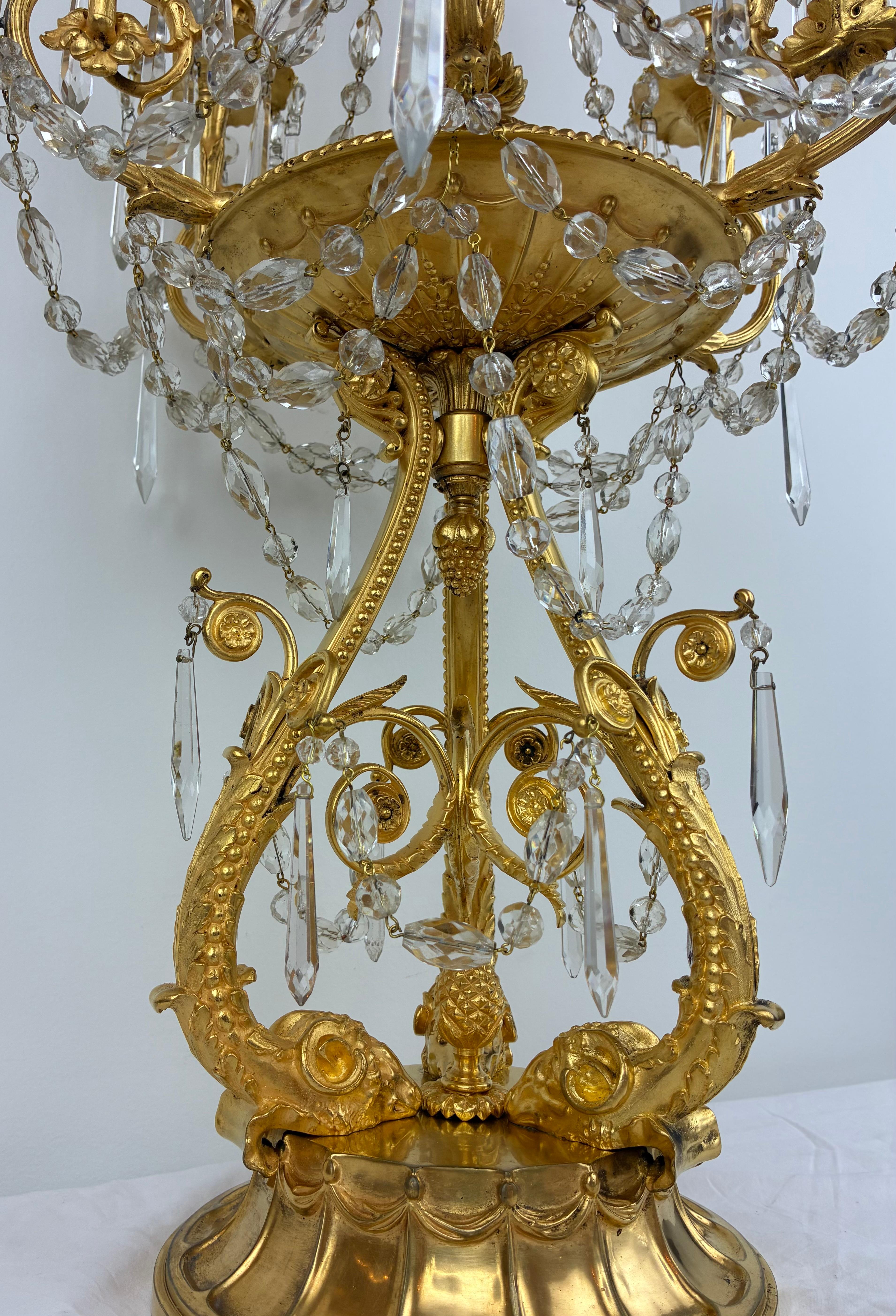 This amazingly detailed pair of candelabra are by the renowned firm of Edward F Caldwell, and are pictured in their archives.
In the Georgian taste, they feature many Robert Adam style motifs including rams heads, bellflowers and acanthus