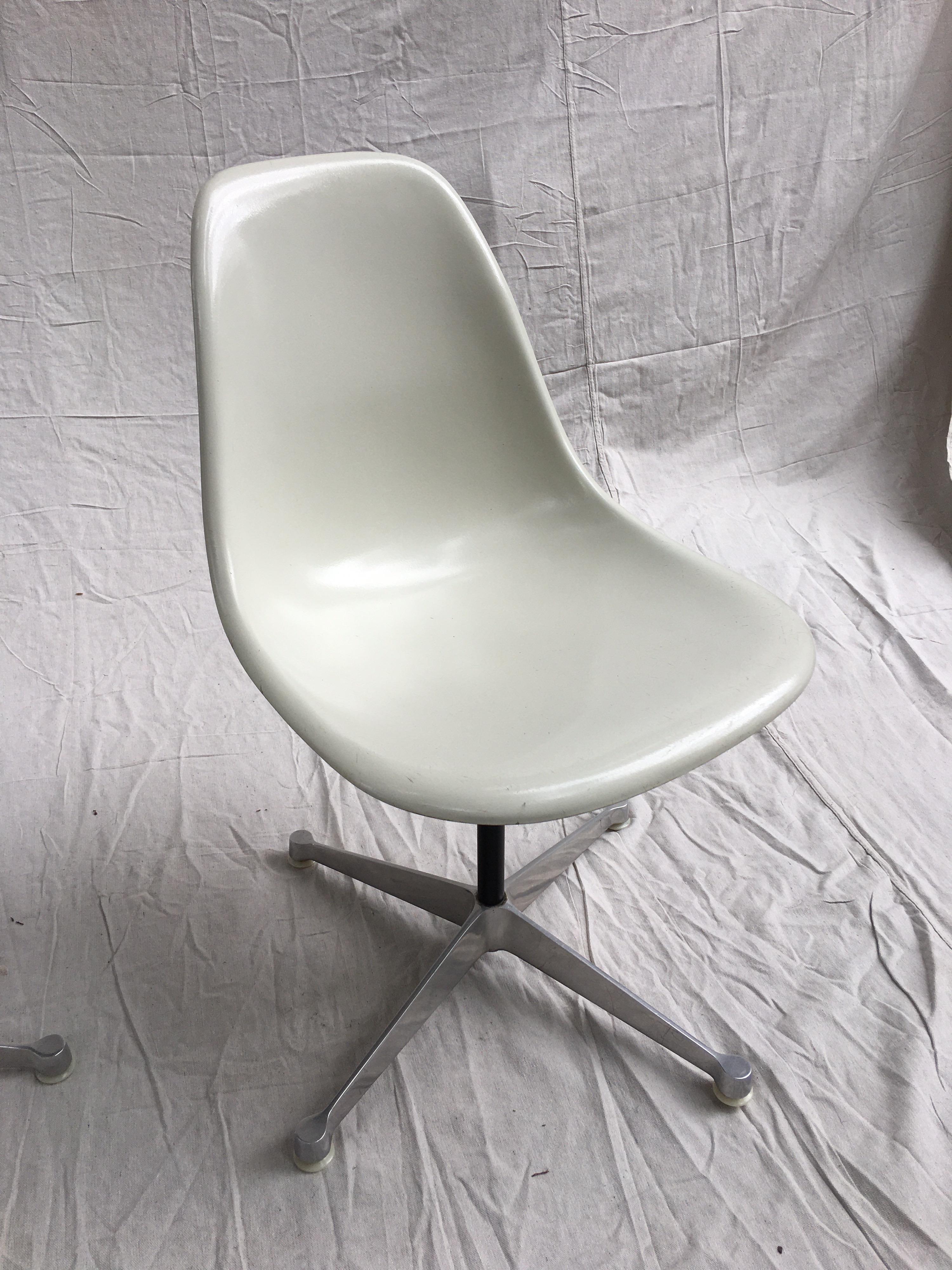  White Charles and Ray Eames fiberglass side chair on star base. Very clean example, base in very nice condition!  One Chair remaining!