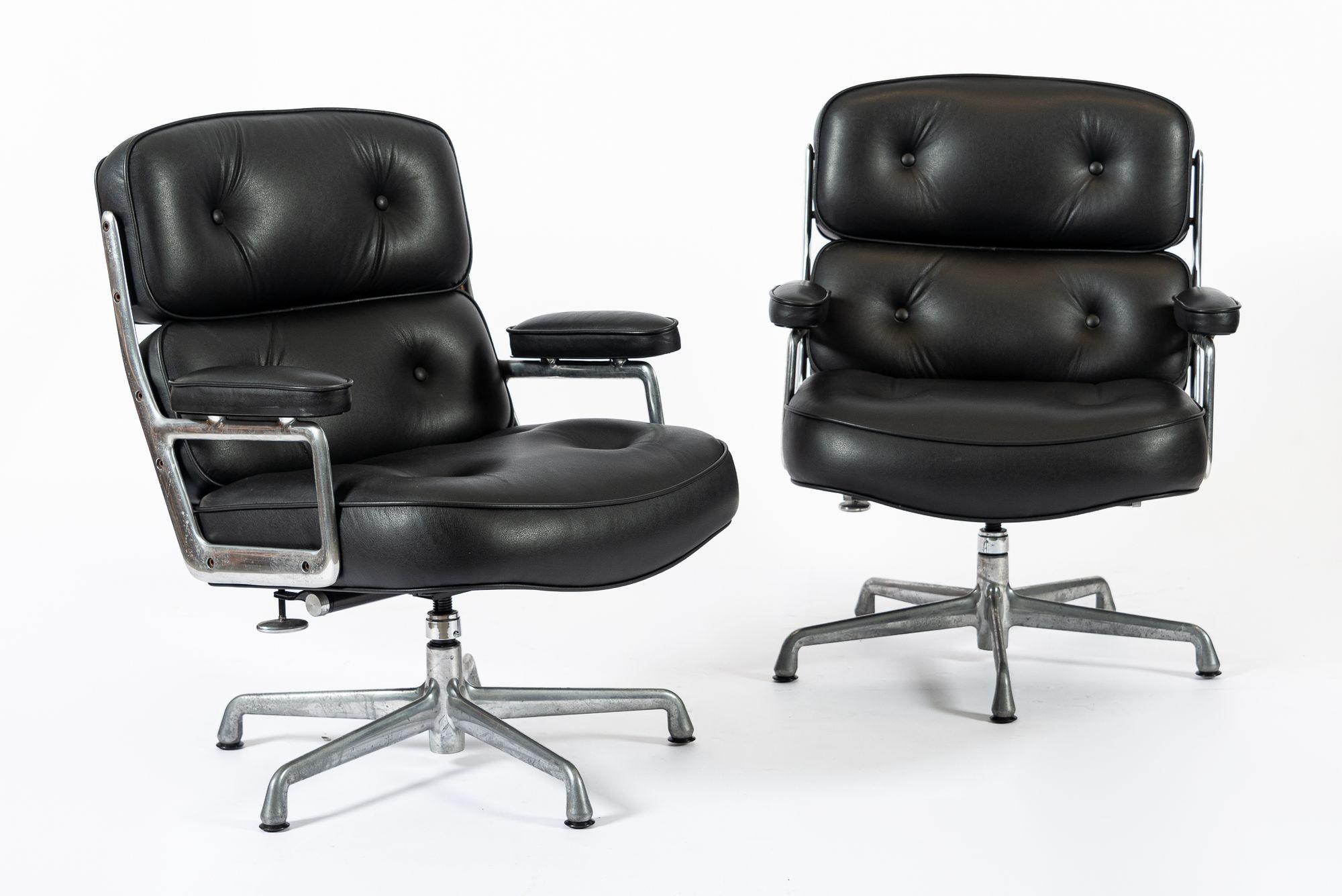 These mid century modern black Model 3475 Eames Time Life Lobby Chairs designed by Charles & Ray Eames for Herman Miller were produced in 2015. This classic office chair features original black leather upholstery and a four-star cast aluminum swivel