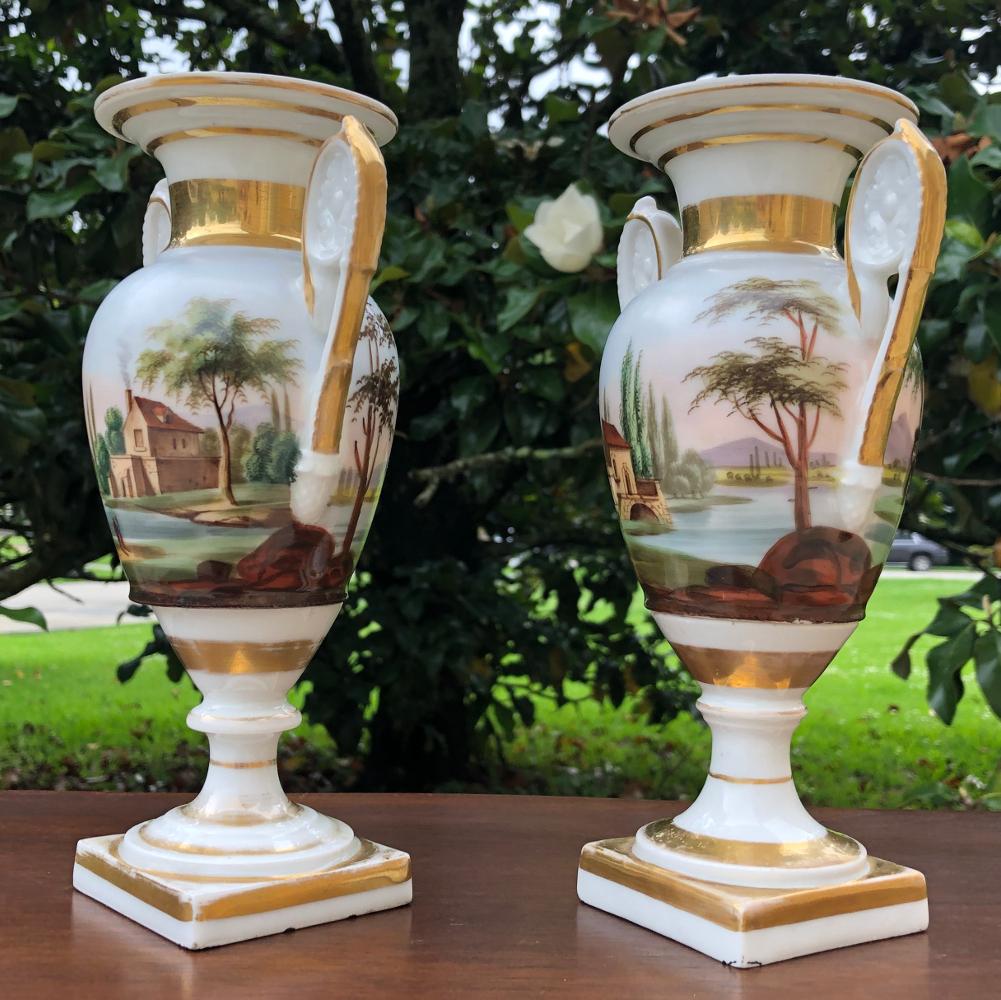 Pair early 19th century French Vieux Paris hand-painted porcelain vases feature a lovely Mediterranean seaside scene, painted all around so they work even in front of a mirror, by design of course! Classical Greco-Roman architecture is enhanced by