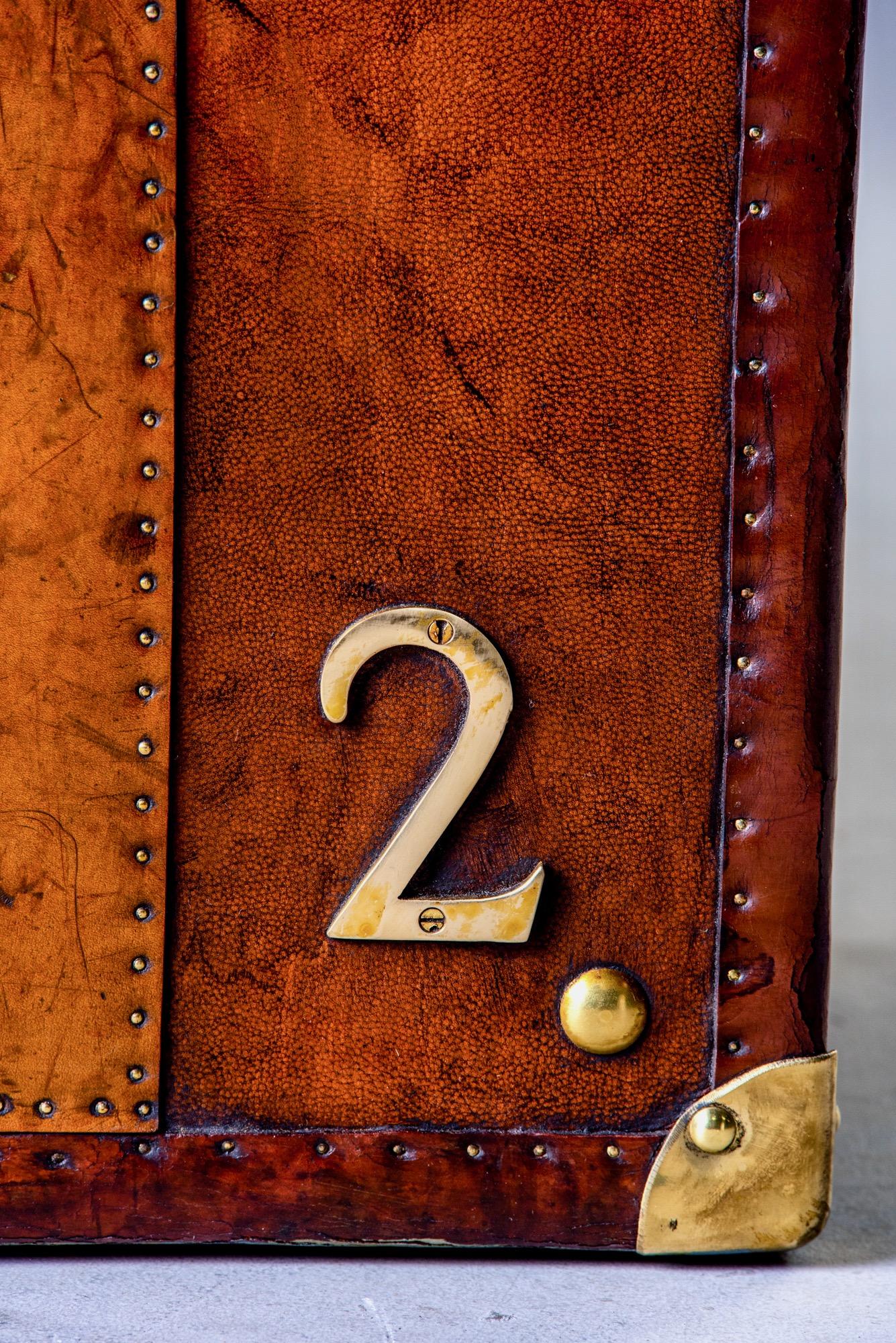 Pair of Restored English Leather Trunks with Regimental Cartouche 5