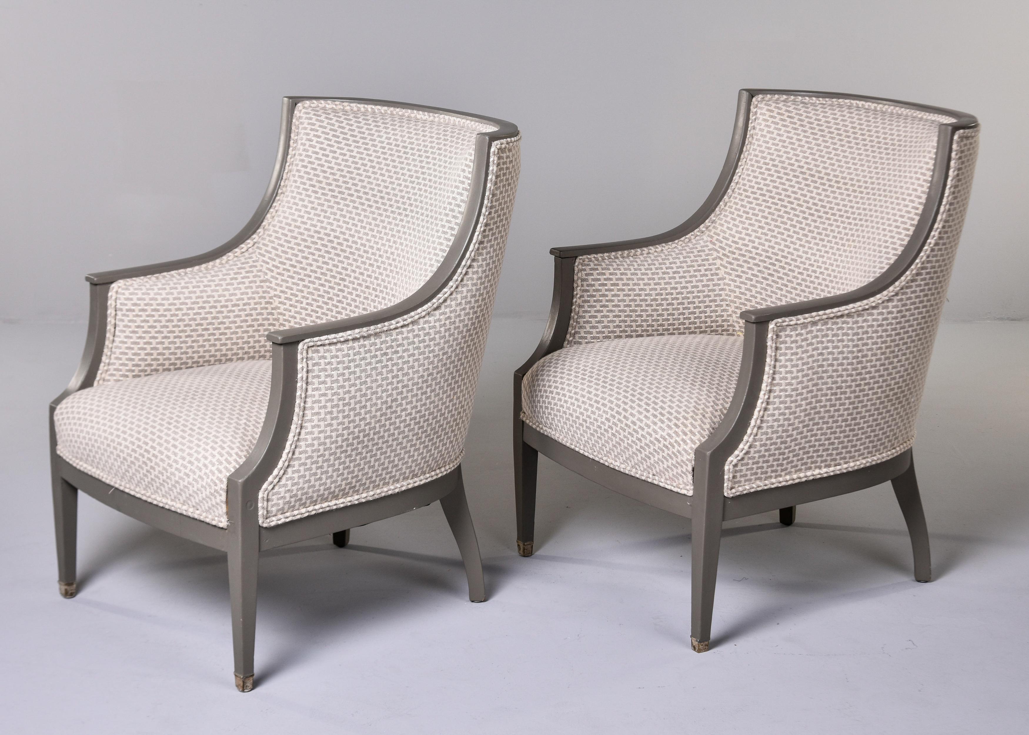 Found in Europe, this pair of Swedish chairs date from the 1930s. Wood frames have a painted finish in a shade of greige. Chairs have been newly upholstered in a cream colored chenille with an all-over, raised, basket-weave style pattern in greige