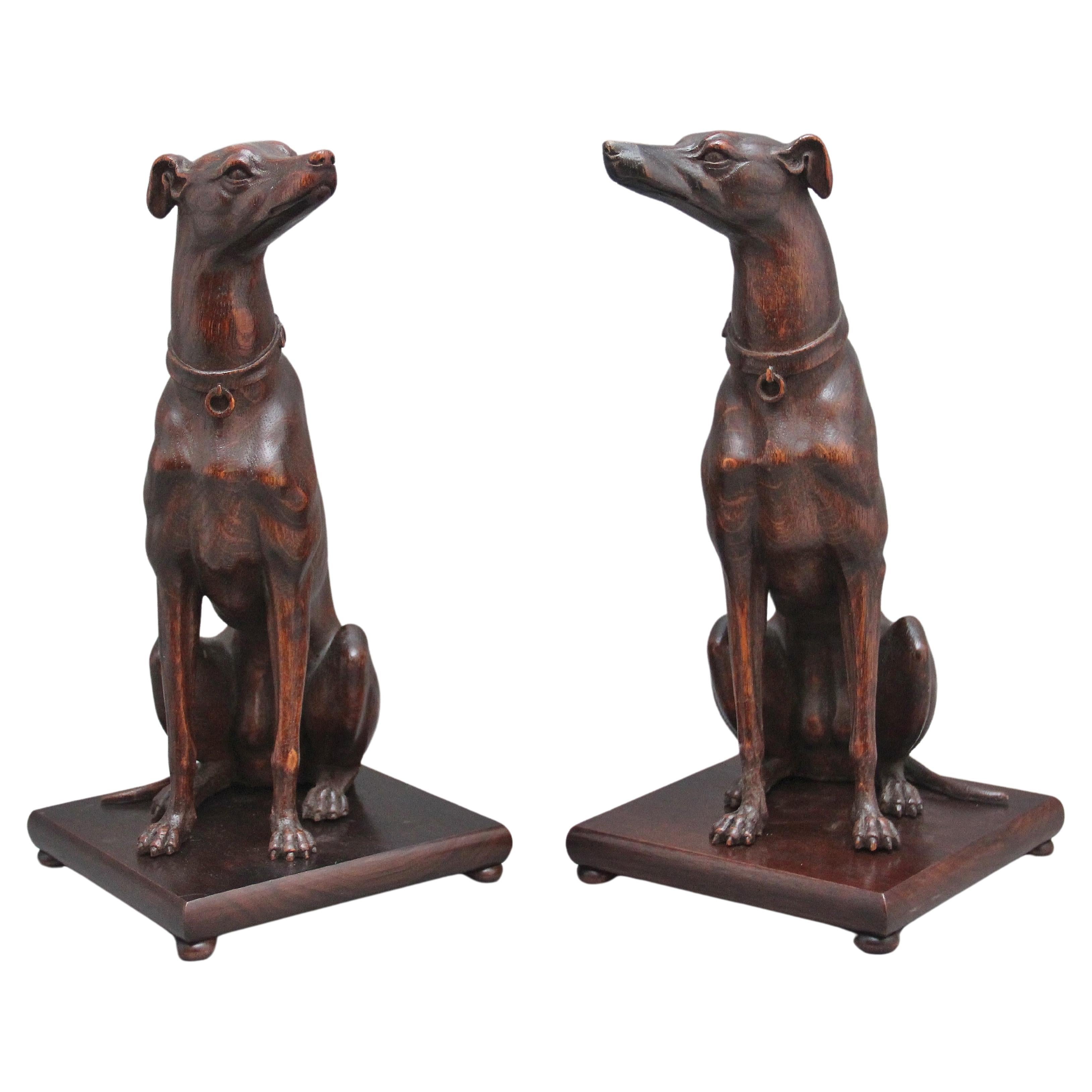 Pair early 20th Century carved oak greyhounds