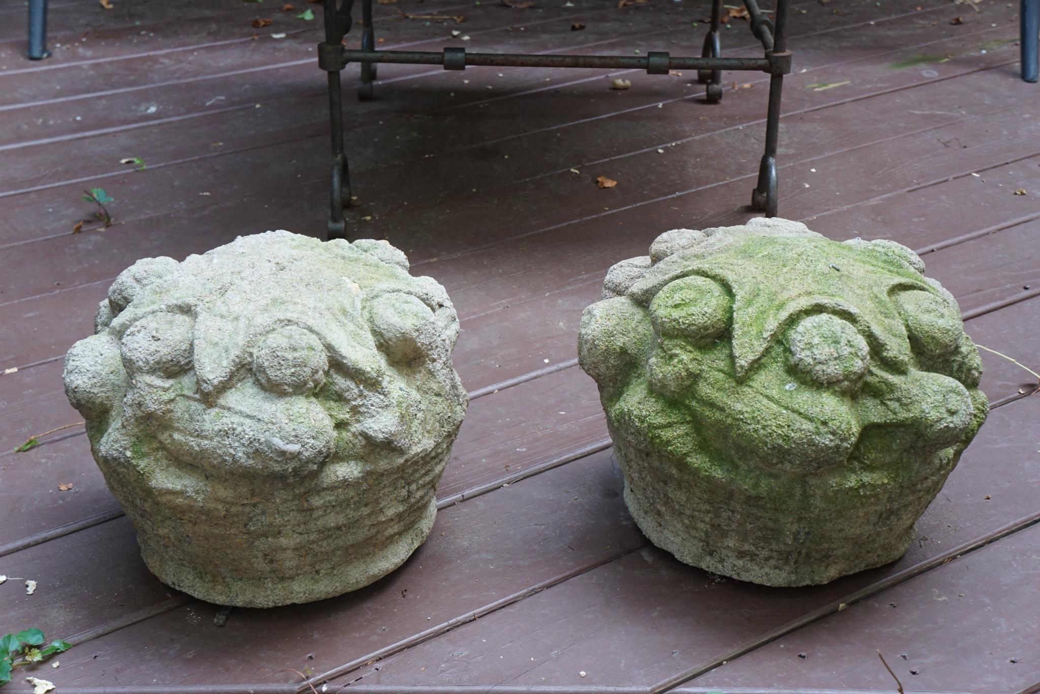 This pair of very unusual cast stone baskets are centered with a large starfish on the top. This is a form we have never seen in 40 years in the business. The baskets are well articulated with a woven surface and the fruit is large and nicely