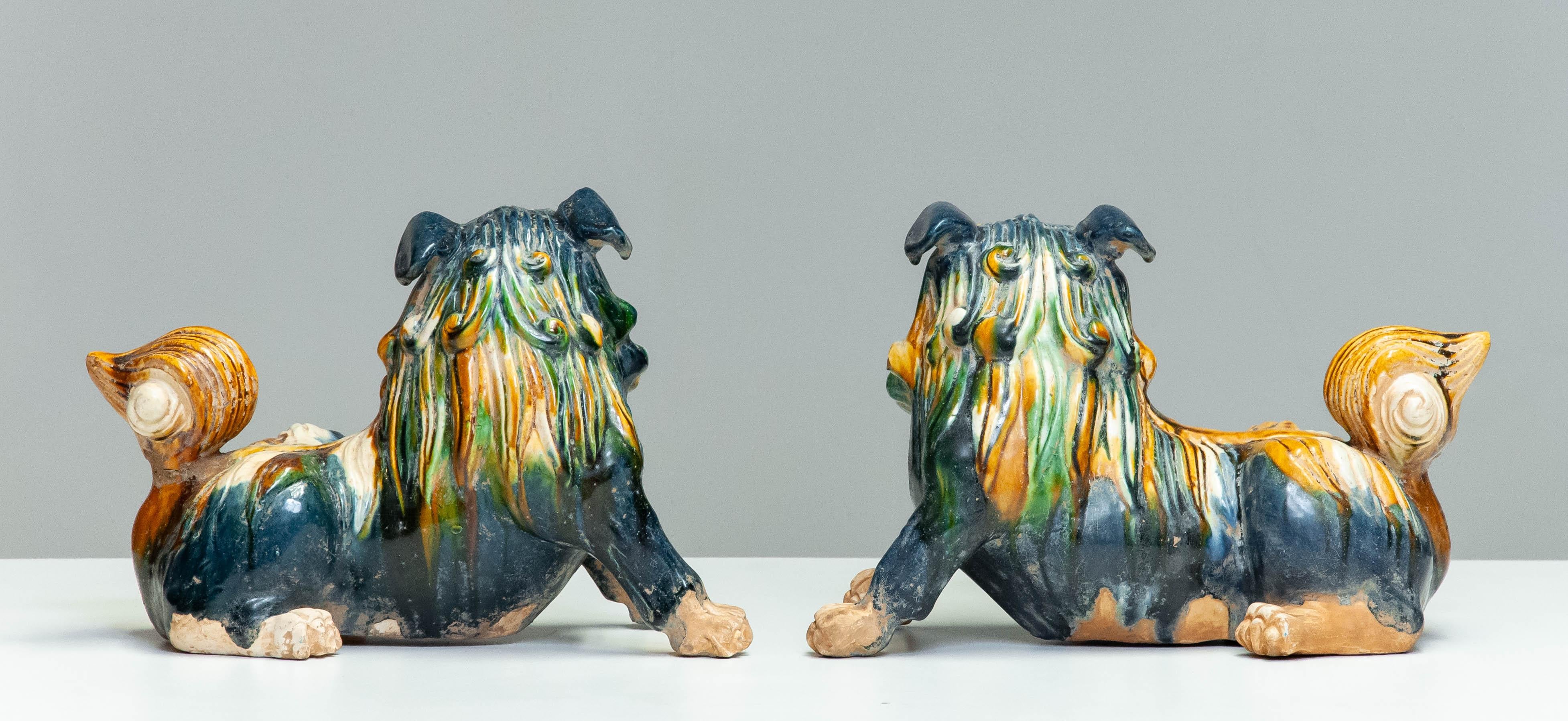 Glazed Pair Early 20th Century Chinese Ceramic Foo Dogs For Sale