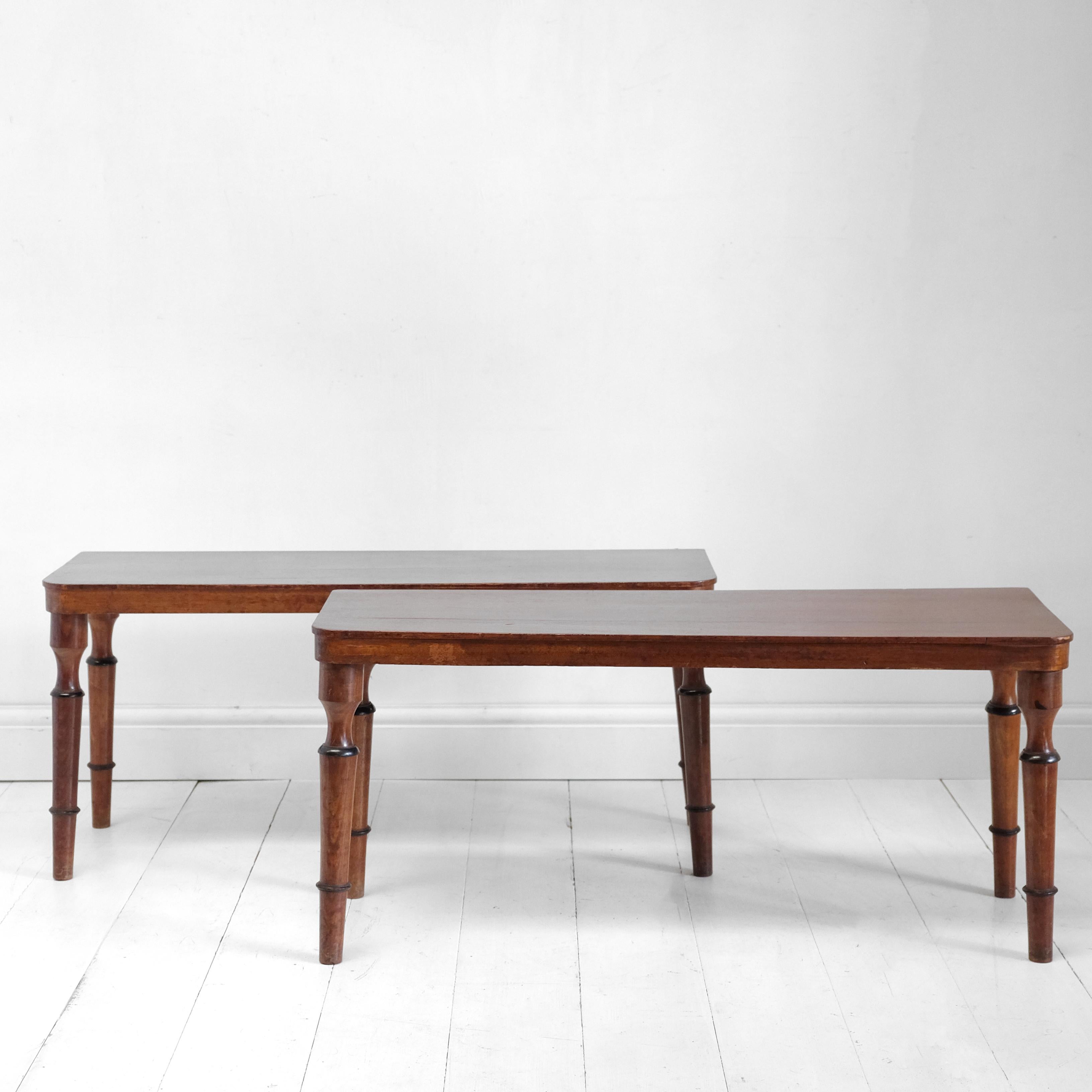 A matching pair of early 20th century mahogany hall benches. Each with ring-turned legs and rectangular seats with rounded front corners. I like their simplicity and the touch of detail with the ebonized rings on each leg.

Price is for the