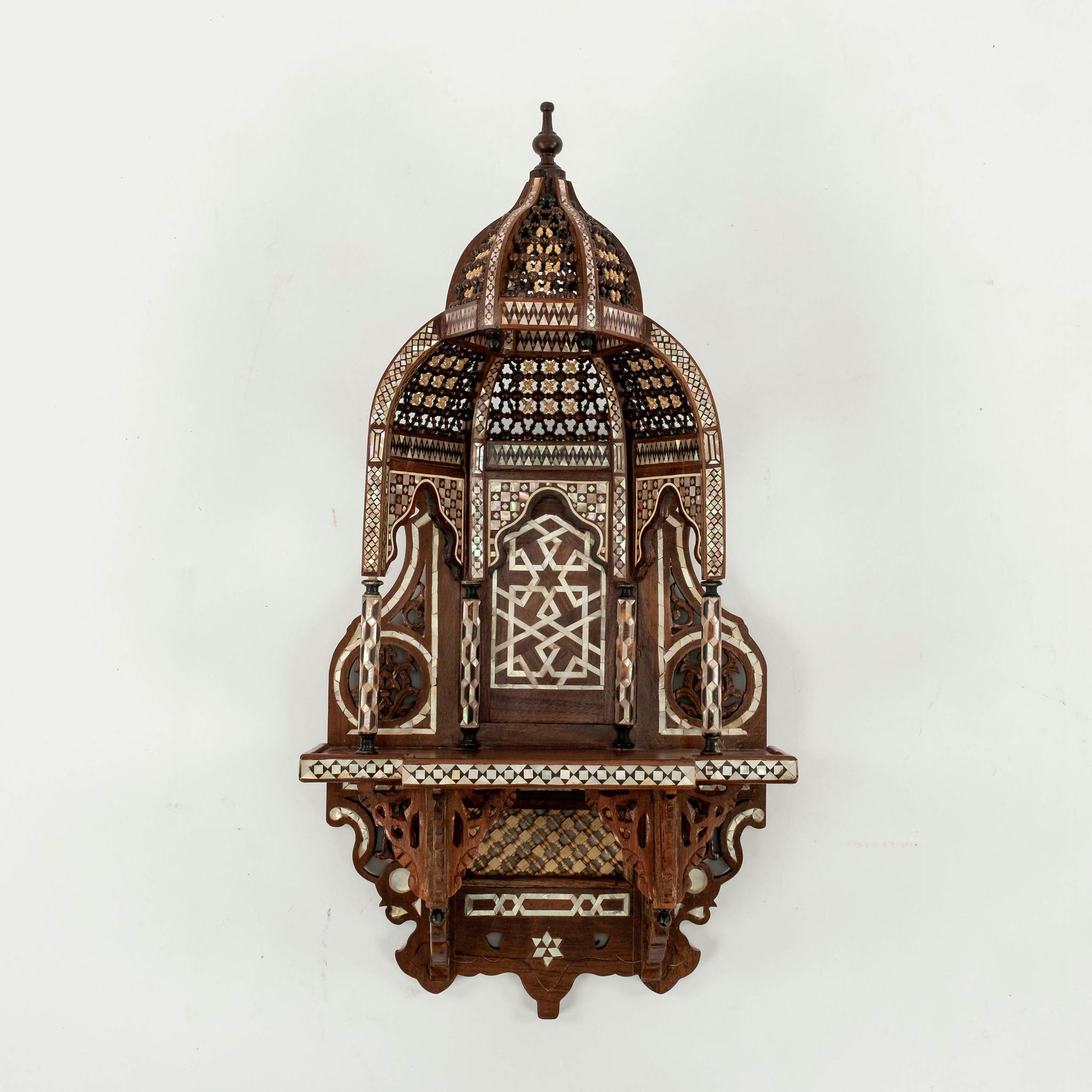 Pair 1920s or earlier Moroccan wood and mother of pearly inlay wall shelves. These wonderful Múdejar design shelves feature abstract geometry, horseshoe and multifoil arches, and honeycombed vaults called muqarnas supported by miniature columns.