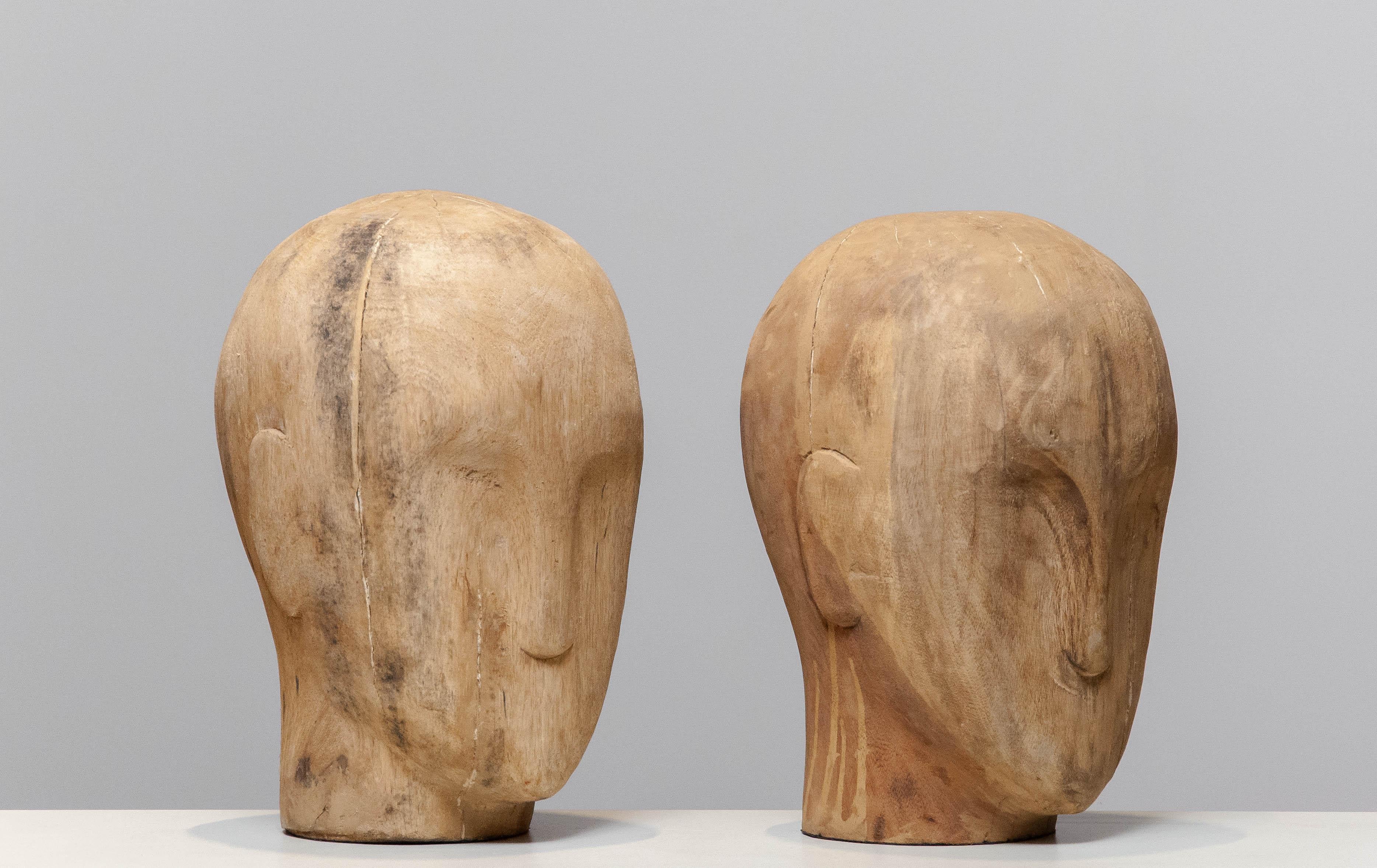 Beautiful pair faded wooden gent milliners heads from the early 1900's.
The faded lines and the non-treated wood gives these heads there beautiful character. Absolutely top of the line decorative objects. 
Please note that we have one more in our
