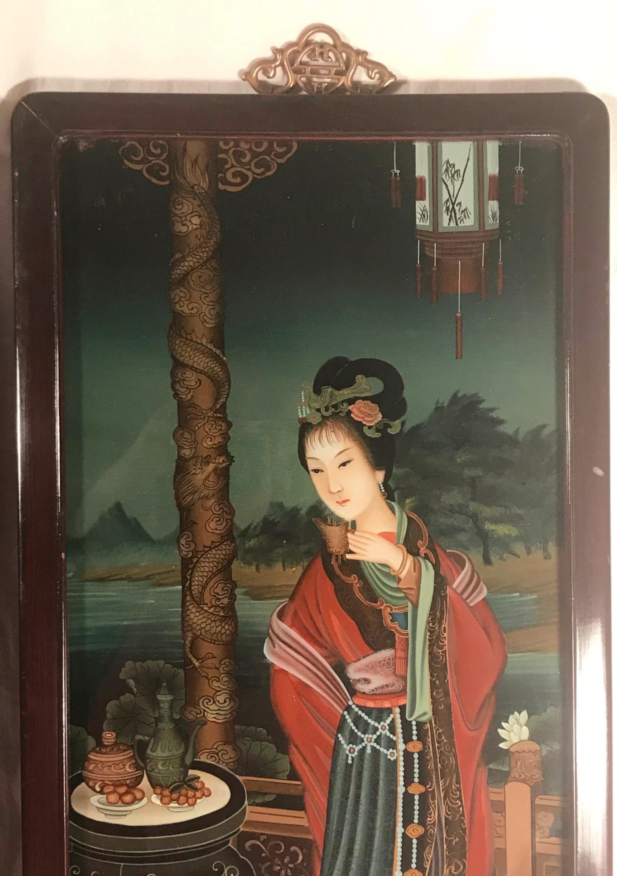 Pair of early 20th century Verre Eglomise Chinese Export Reverse glass paintings.

Beautiful pair of Chinese reverse glass paintings of Geisha girls. This matching pair is exquisite in color and detail. The wood framed paintings are in good