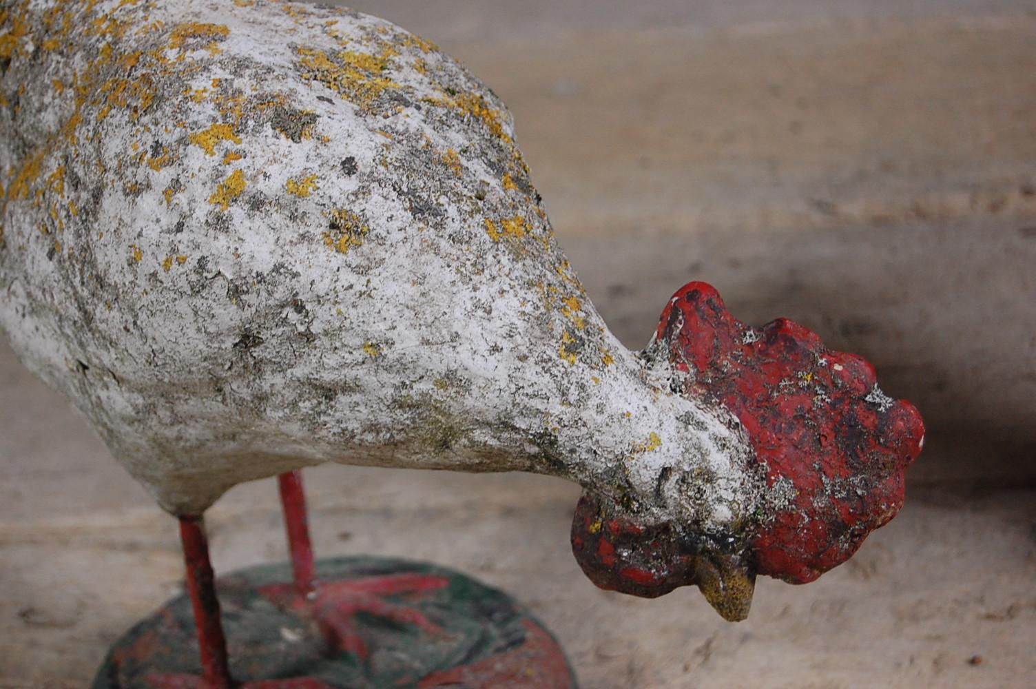 Early 20th century pair of concrete chickens, a cockerel and a hen. Well weathered with lots of lichen growth, France, circa 1920. Measurement for largest chicken, priced for the pair.