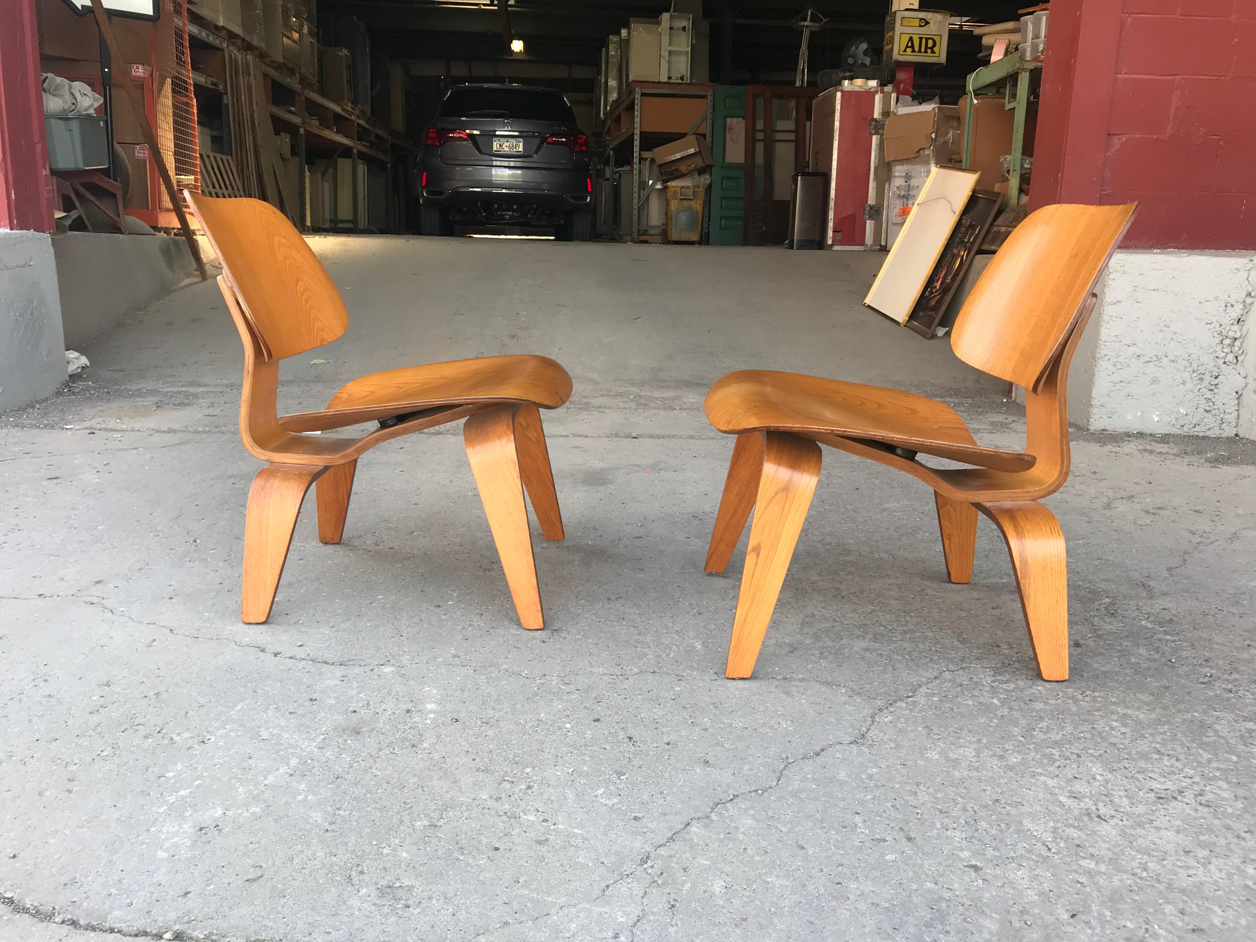 American Pair of Early Production Eames L C W's, 5-2-5- Screw Configuration