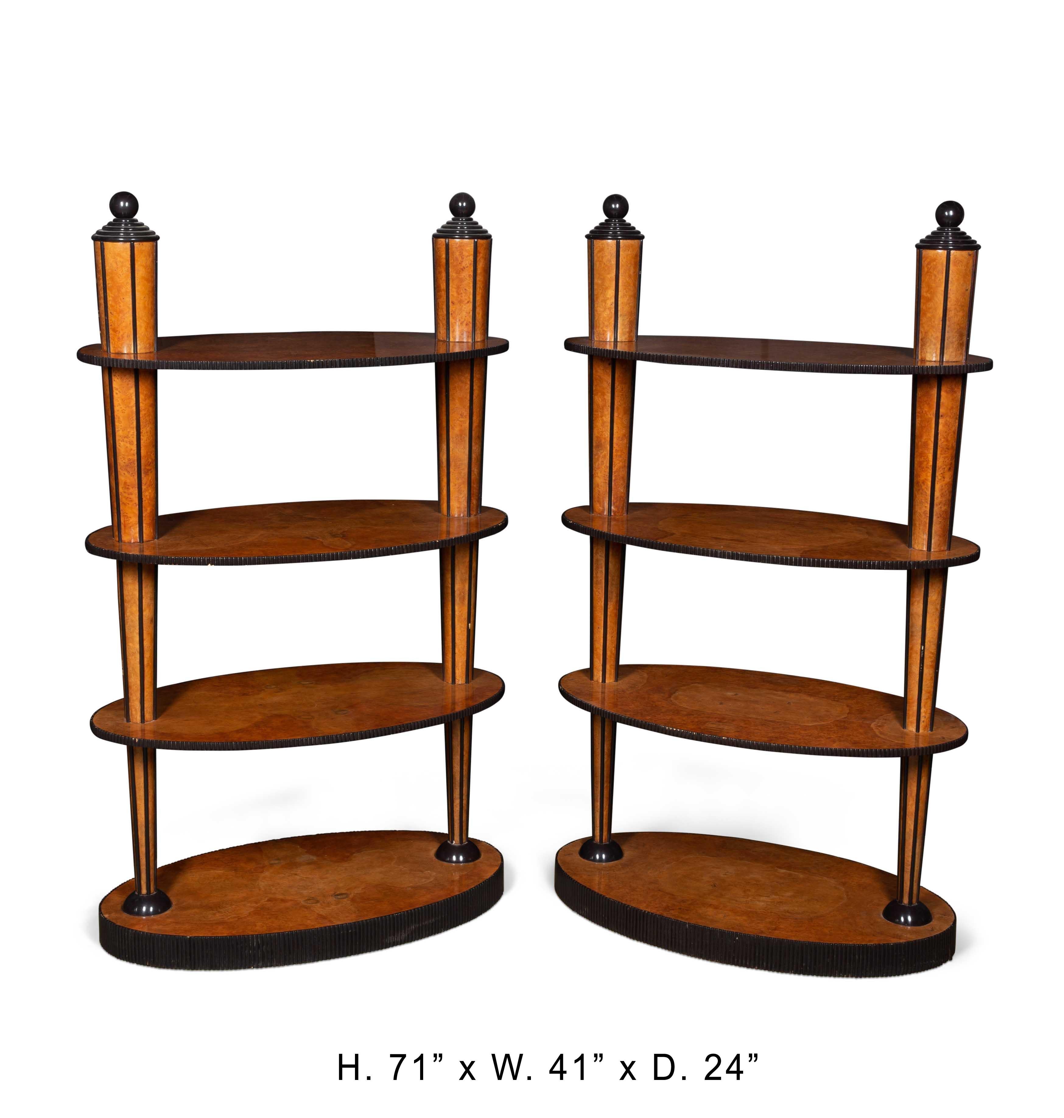 Outstanding 19 century pair English ebonized and burlwood oval etageres shelving.
Each etagere has four oval shelves held by two tapered columns and all veneered with burlwood and inlaid with ebony .
The most unusual etageres we have seen in 40