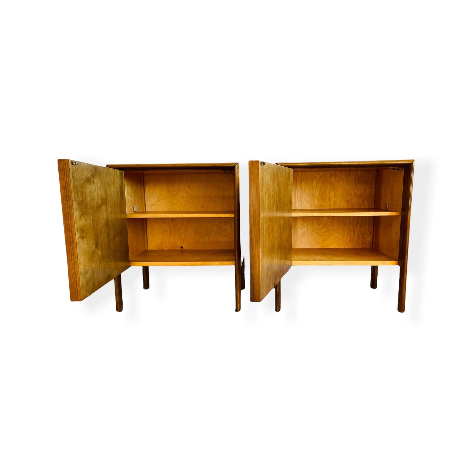 Here is an exceptional pair of mid-century Swedish Modern sculpted walnut nightstands by Edmonds Spence circa 1950s. These nightstands are equipped with sculptured door to open to storage with one shelf. Nightstands are in good vintage condition