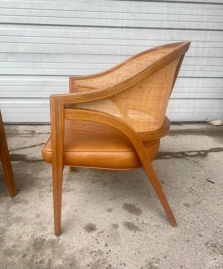 Stunning  Pair Dunbar Lounge Chairs designed by Edward Wormley,,Retains early 'D' metal badge label,, minor damage to caning ( see photo),, Extremely comfortable,, Classic style and design.. Hand delivery avail to New York City or anywhere en route