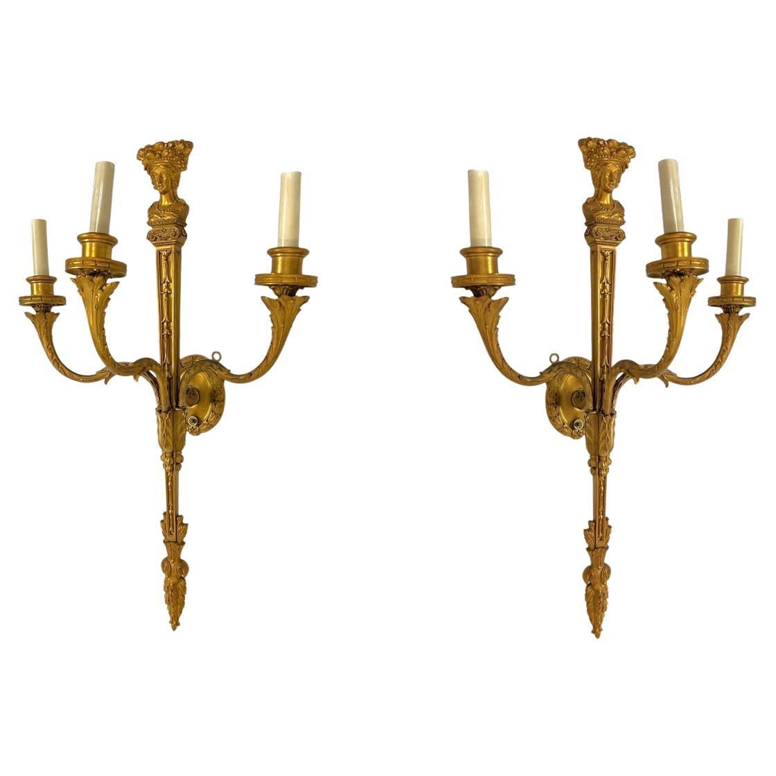 Coppia E. F. A. Caldwell Neoclassico in bronzo dorato a tre luci