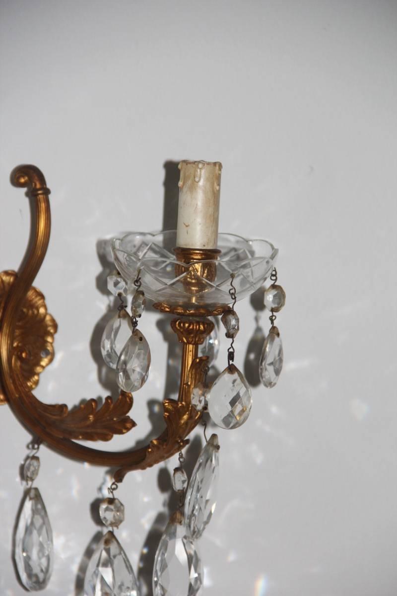 Pair of elegant and particular sconces bronze and crystal 1950s, Italian design.