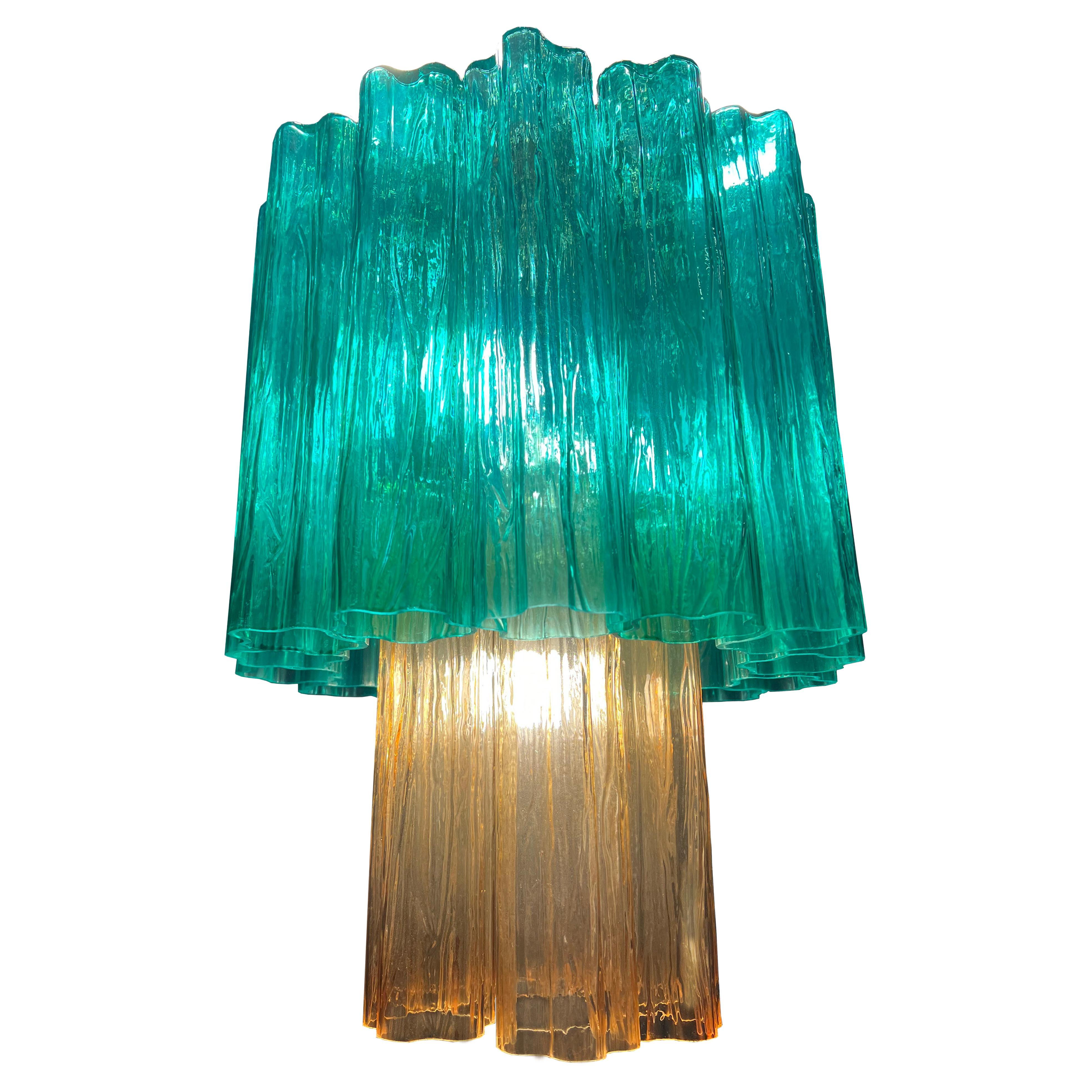 Pair chandeliers of refined elegance inspired by the colours of the Costa Smeralda (Sardinia). Made of pure Murano glass elements. A larger version is also available. Also available for 220 volts outside the USA.