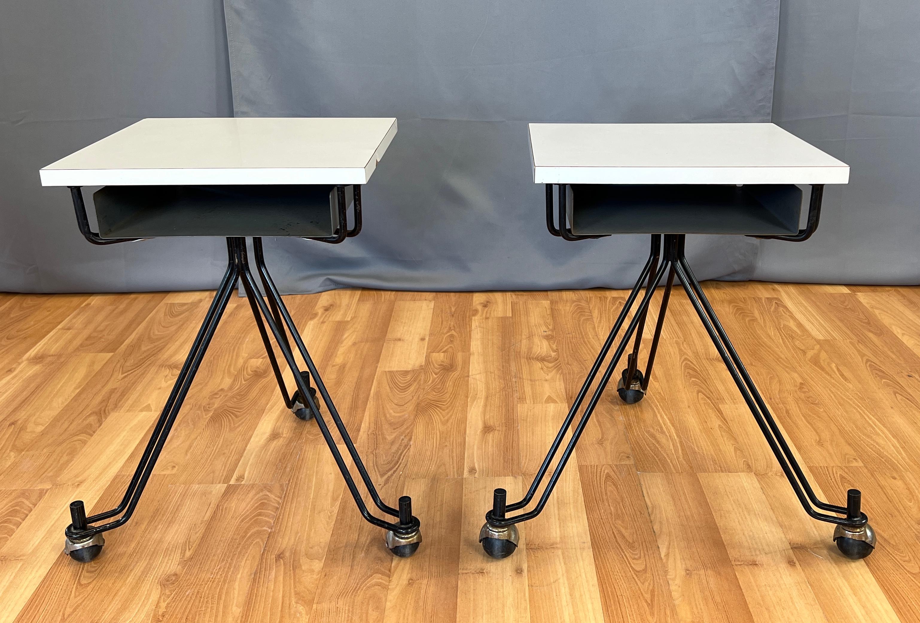 Offered here are a pair Eliot Noyes designed telephone tables for IBM corporate offices circa 1950s
Eliot is most notably known for the IBM Selectric typewriter.
Square white formica top, below a storage space (for a phone book) that's 2 3/4