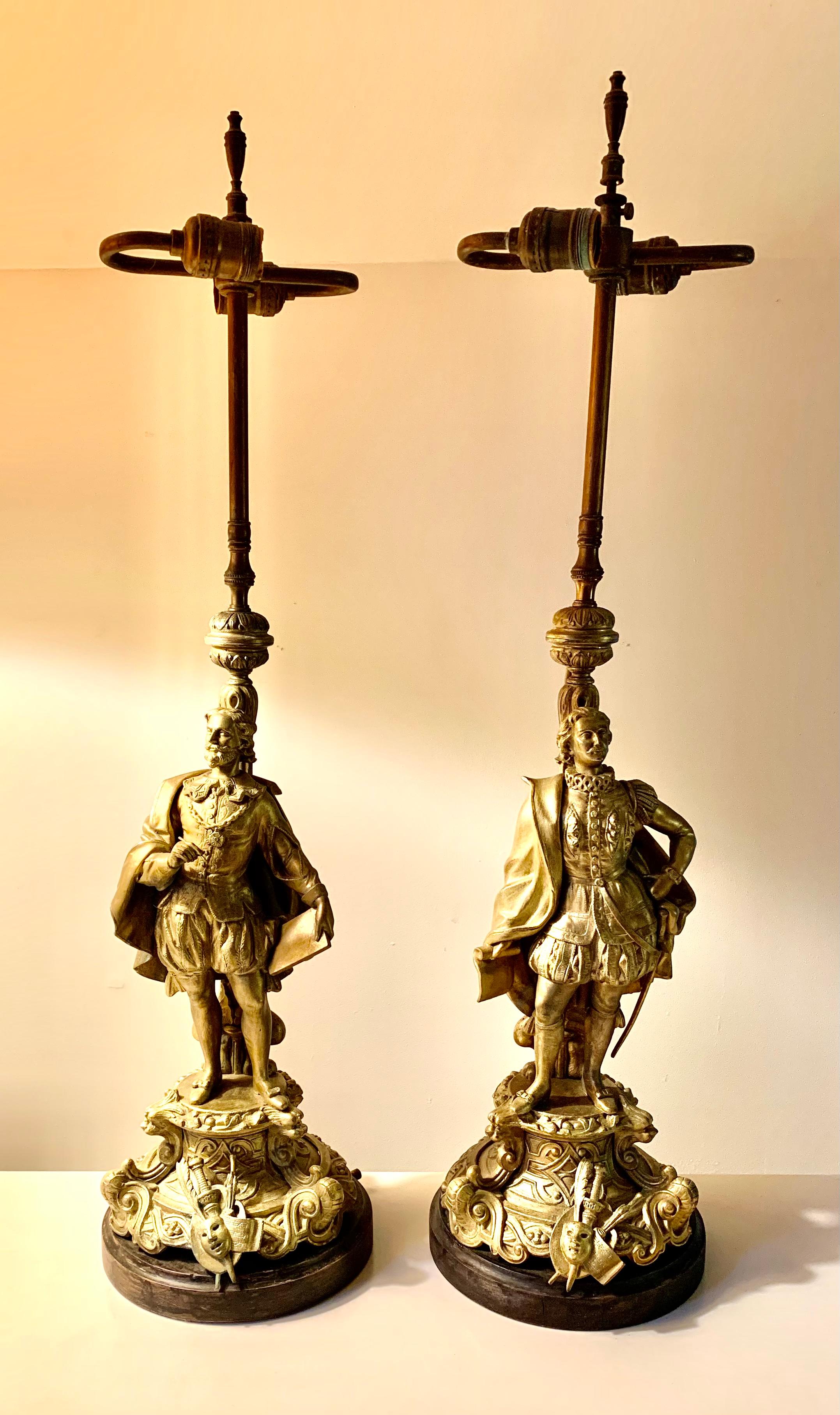 Fabulous pair of Elizabethan style 19th century theatrical interest figural table lamps depicting William Shakespeare and Christopher (Kit) Marlowe. 
Shakespeare in period formal attire holding a quill and parchment, Marlowe in high Elizabethan