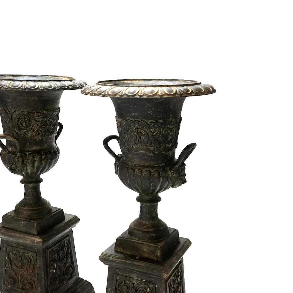 Pair Embossed Cast Iron Classical Double Handled Garden Urns on Plinths, 20th C In Good Condition In Big Flats, NY