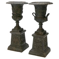 Vintage Pair Embossed Cast Iron Classical Double Handled Garden Urns on Plinths, 20th C