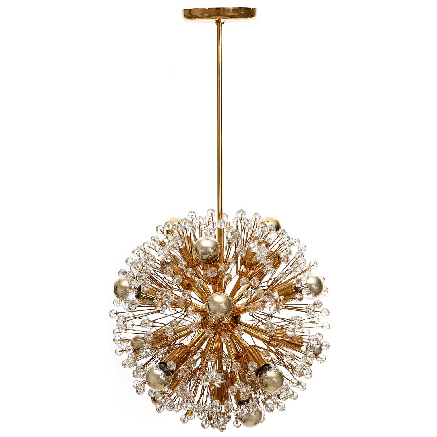 Two Sputnik chandeliers or pendants designed by Emil Stejnar and manufactured in midcentury, circa 1970.
This beautiful light fixture is made of a 24-carat gold-plated brass frame which is decorated with cut glass in the form of beads and stars.