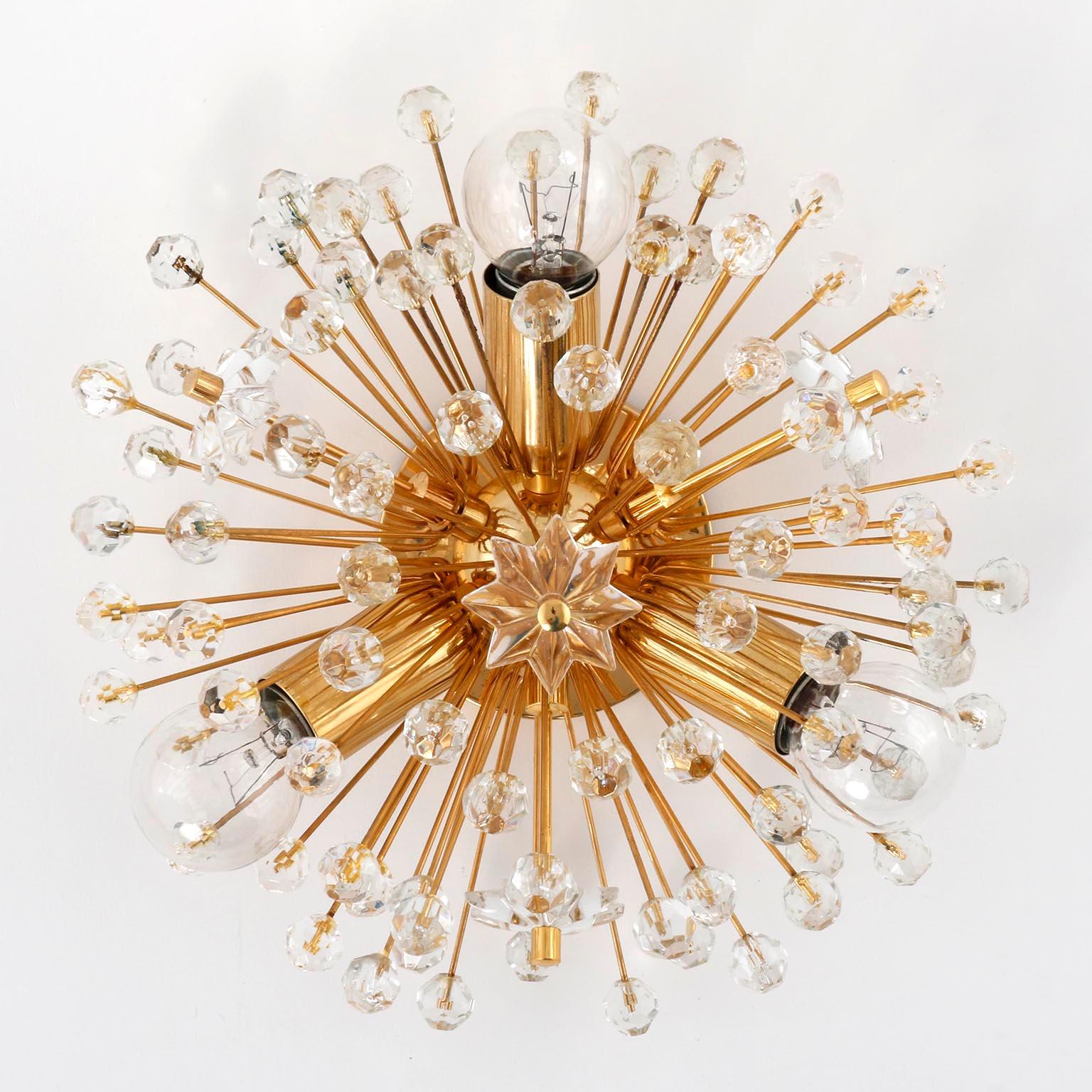 A pair of beautiful Viennese snowflake / blow ball / Sputnik wall lights designed by Emil Stejnar, Austria, manufactured in midcentury, circa 1970 (late 1960s or early 1970s).
High-quality light fixtures made of a 24-carat gold-plated brass frame
