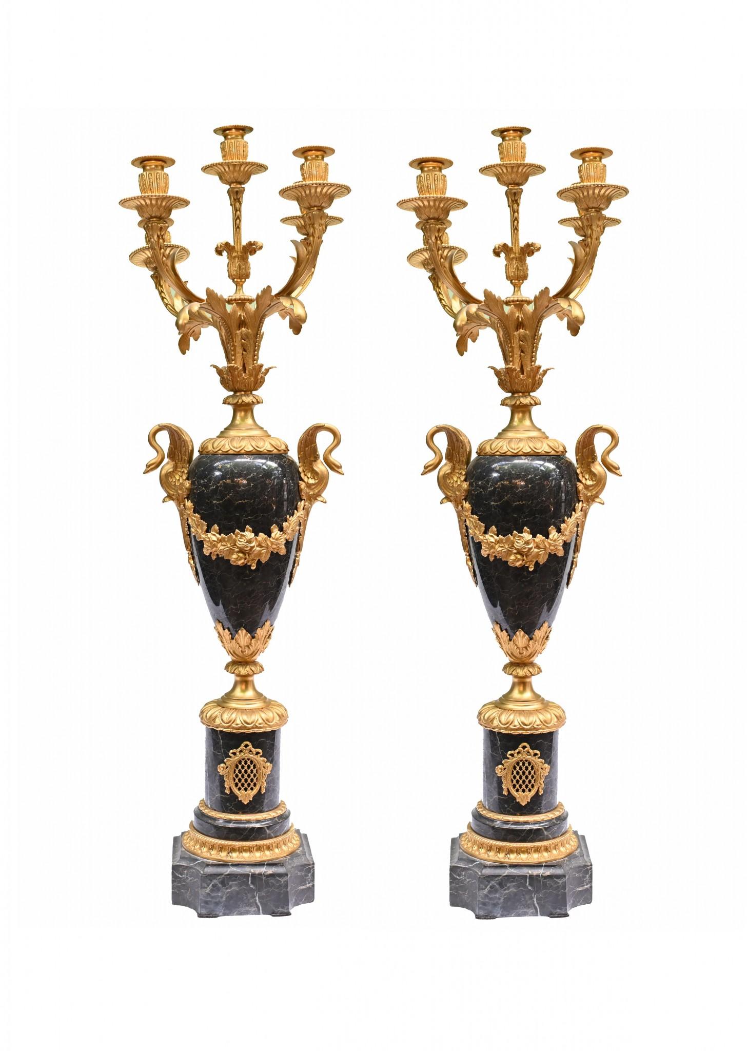 Pair of superb French Empire gilt and marble candelabras
The main urns are of amphora form with distinctive swan neck handles
The height to these is over three feet tall - 98 CM - so good size to them
The casting to the gilt is very detailed and