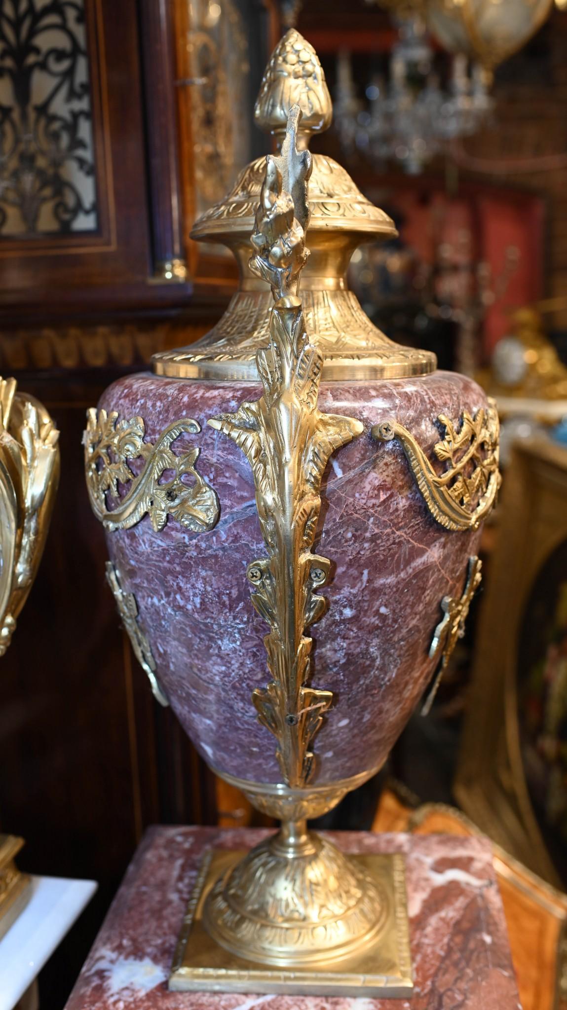 You are viewing a gorgeous pair of French Empire style marble pedestal stands
The stands are surmounted by a pair of monumental matching cassolettes urns of amphora form
Hopefully the photos do this high end pair some justice, they're certainly more