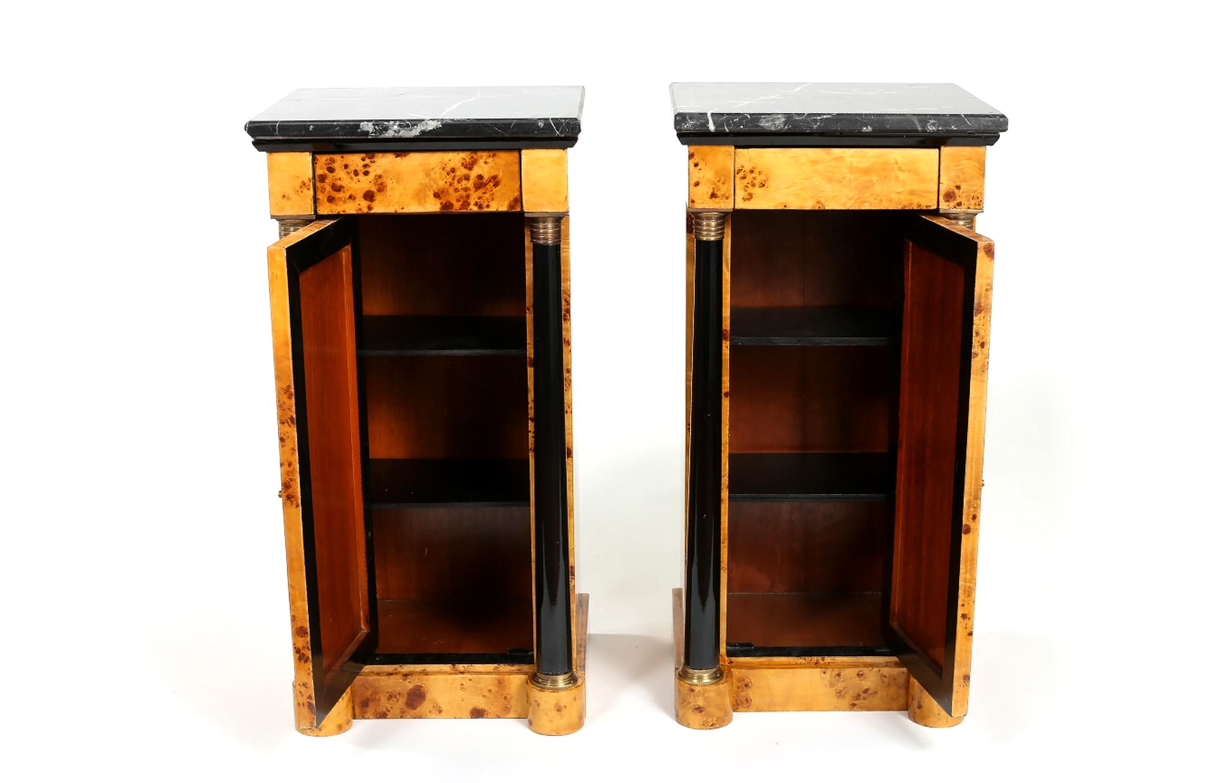 Pair early 20th century Empire style marble-top bar / wood half commodes with top drawer & front door. Each one is in good condition with wear appropriate to age / use. Each commode is about 31.5 inches high x 13.5 inches x 15 inches.