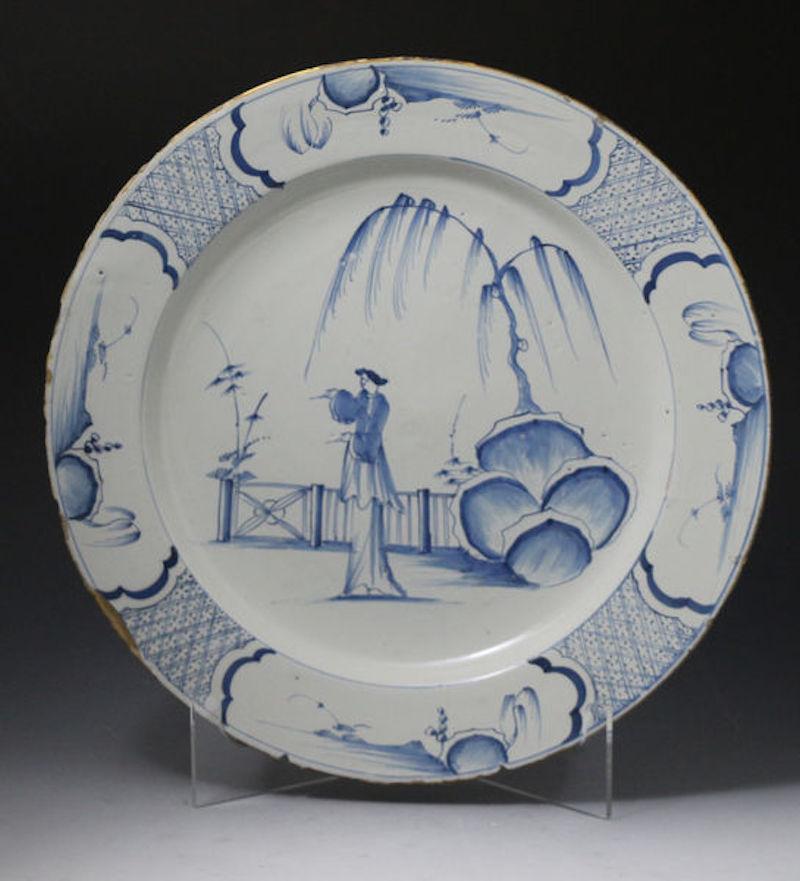 Pair of English blue and white delftware pottery chargers in the chinoiserie style mid-18th century Bristol or Liverpool Delft works.

A fine pair of blue and white chinoiserie decorated chargers from the Liverpool or Bristol delftworks. The