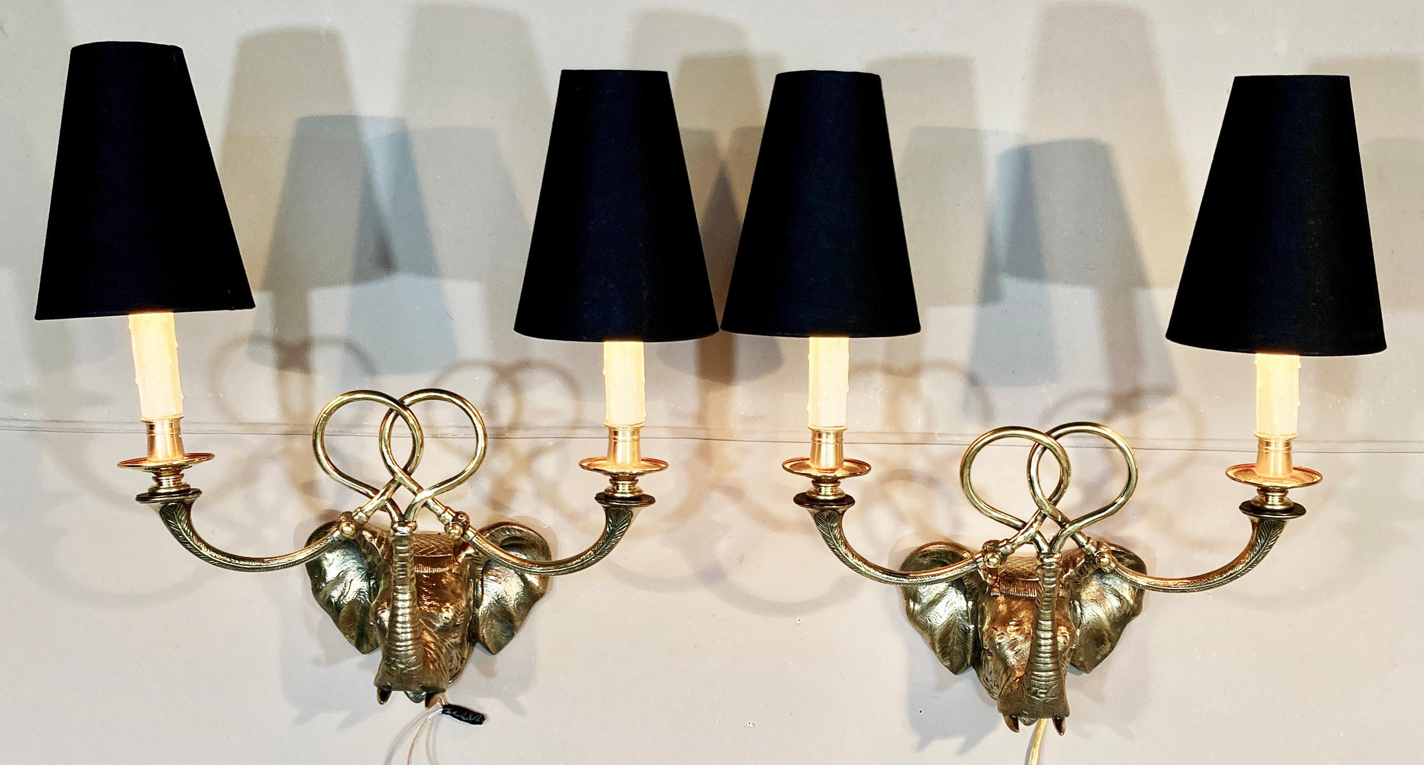 A spectacular pair of antique English brass sconces of the best quality.  The cast detail is crisp and assured, and the modeling is a true and eloquent expression of an elephant.  They are reminiscent of the British Raj style, but they could work in