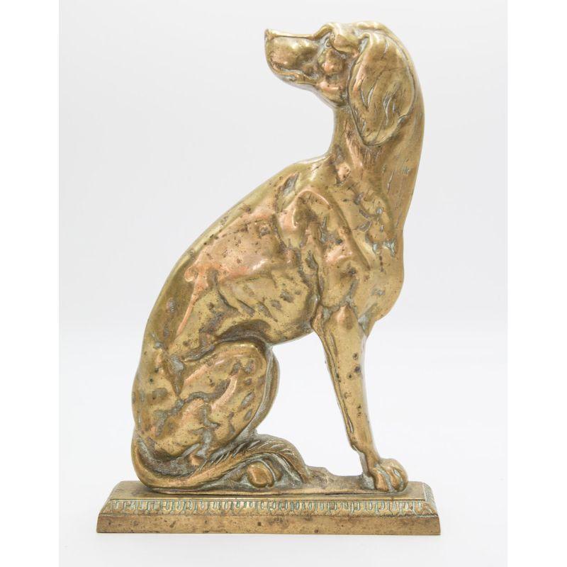 A superb pair of antique English Victorian solid brass fireside or mantel whippet dogs, circa 1880. These fine dog sculptures are a nice large size, solid and heavy, and well made with wonderful details. They retain the lovely original surface and